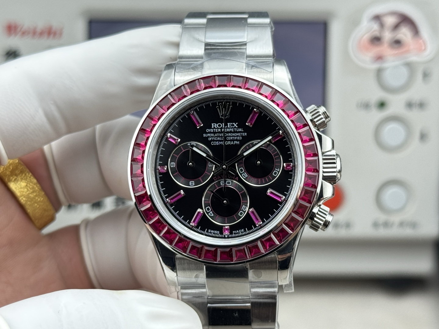 Rolex Daytona replica full front view with ruby-tone bezel and black chronograph dial
