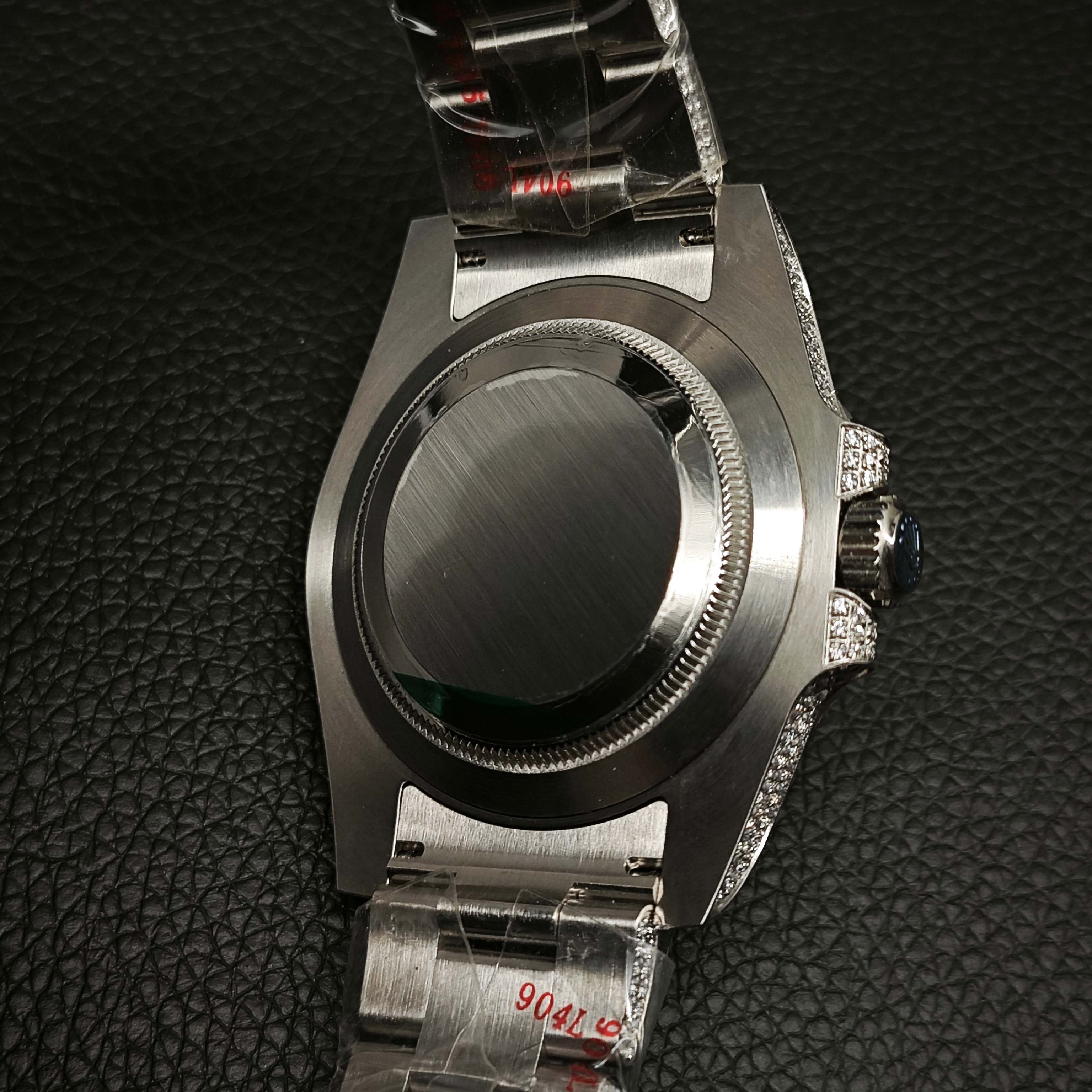 Back view of diamond-encrusted Rolex replica case with protective film and 904L steel markings
