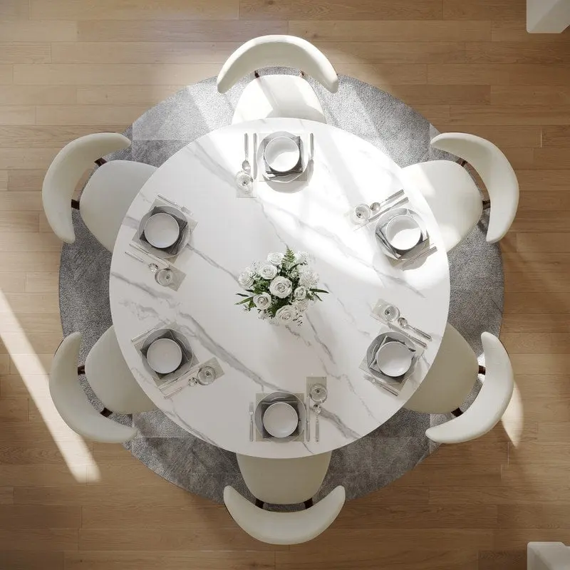 Modern Round Dining Table – White Sintered Stone Top & Bronze Carbon Pedestal