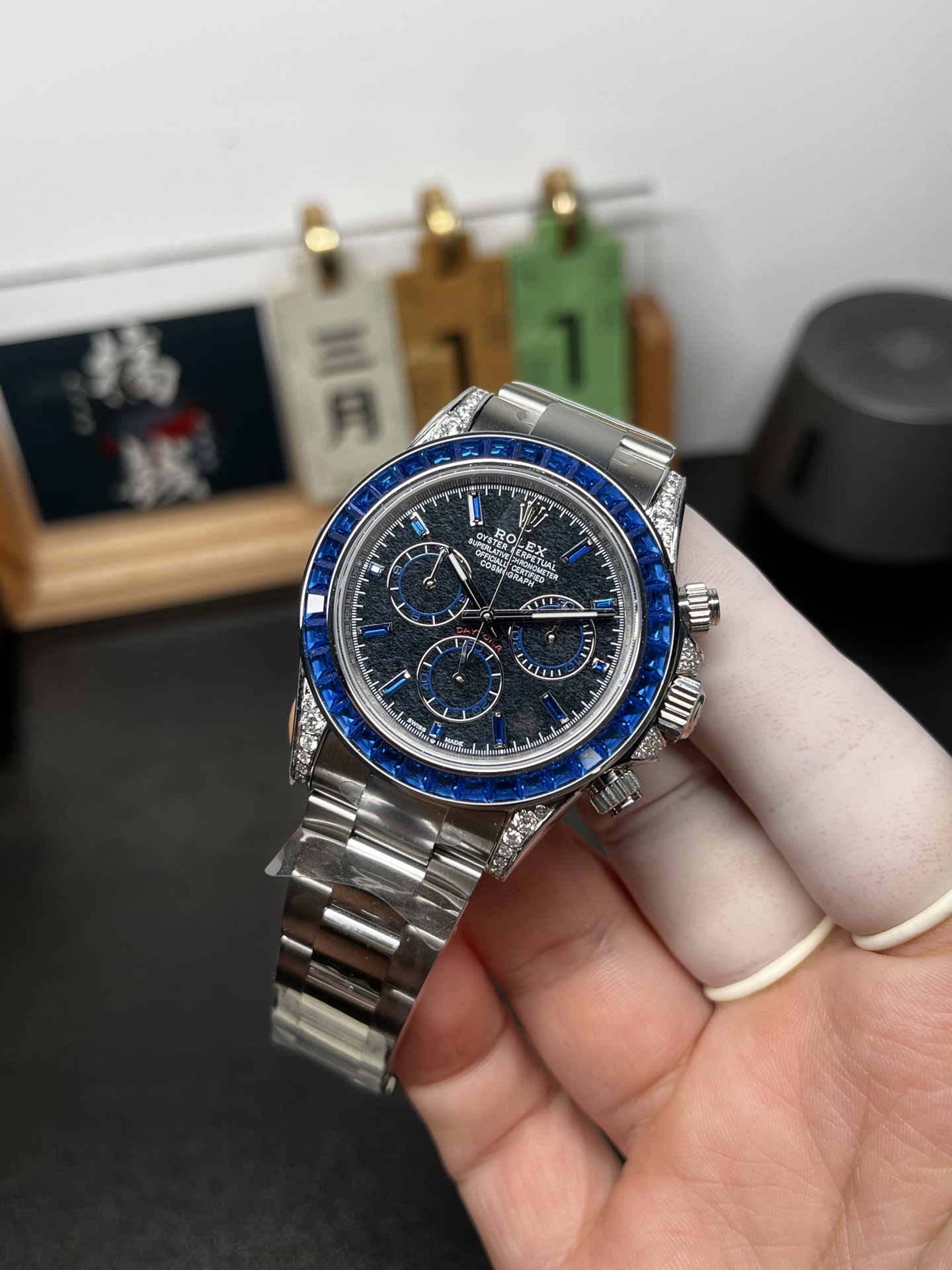 Angled front photo of blue bezel fake Rolex Daytona super clone watch