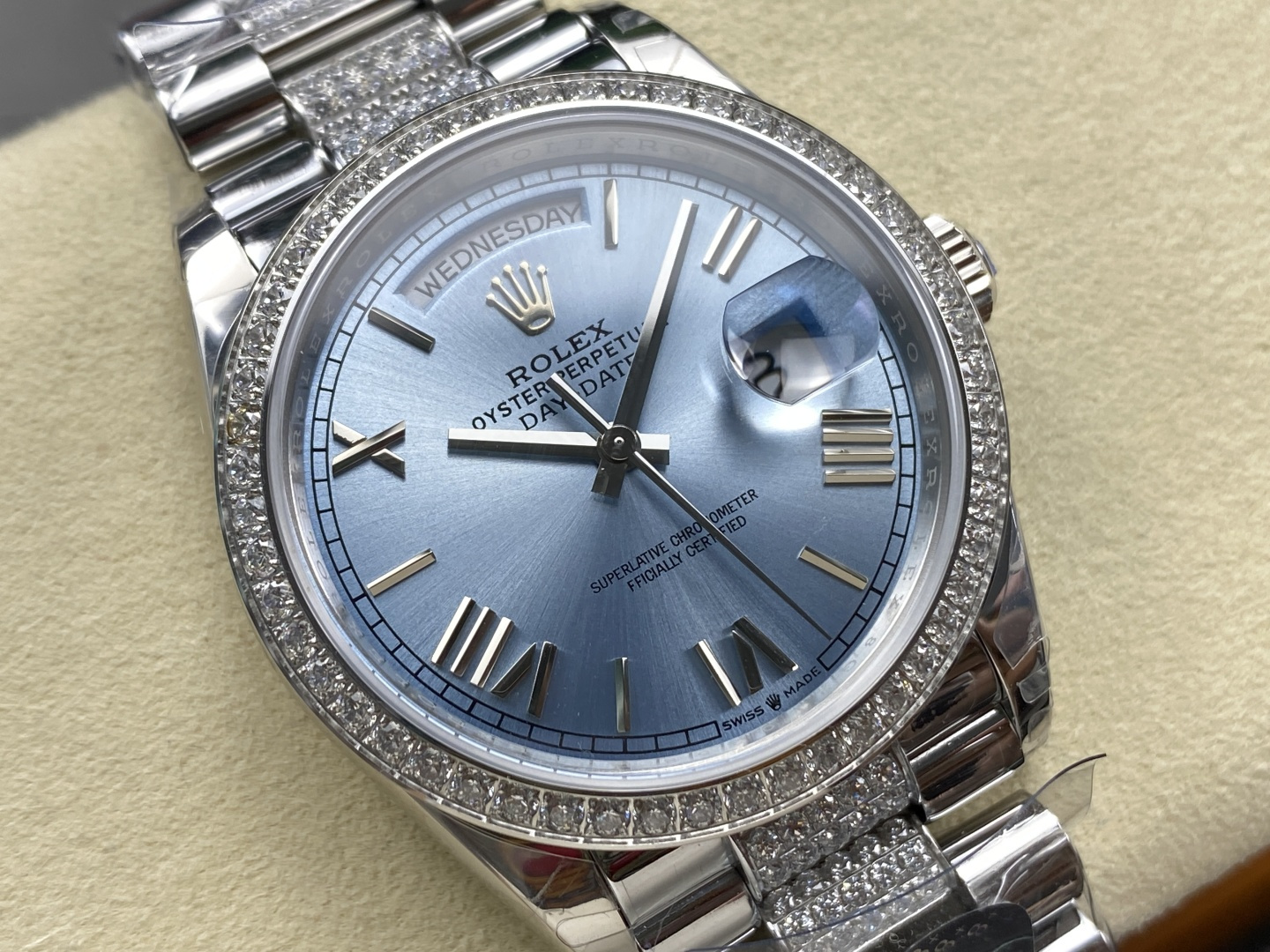 Macro view of blue dial with Roman numerals on a replica Day-Date