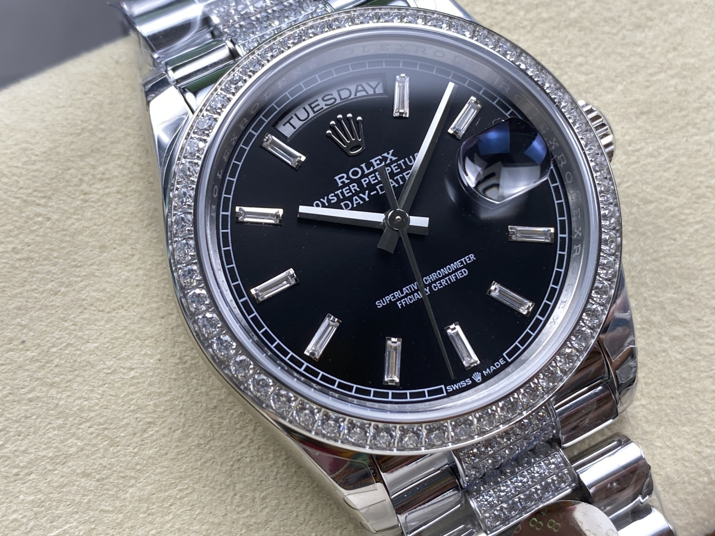 Close-up of the black dial with Roman numerals and day display on a Rolex replica