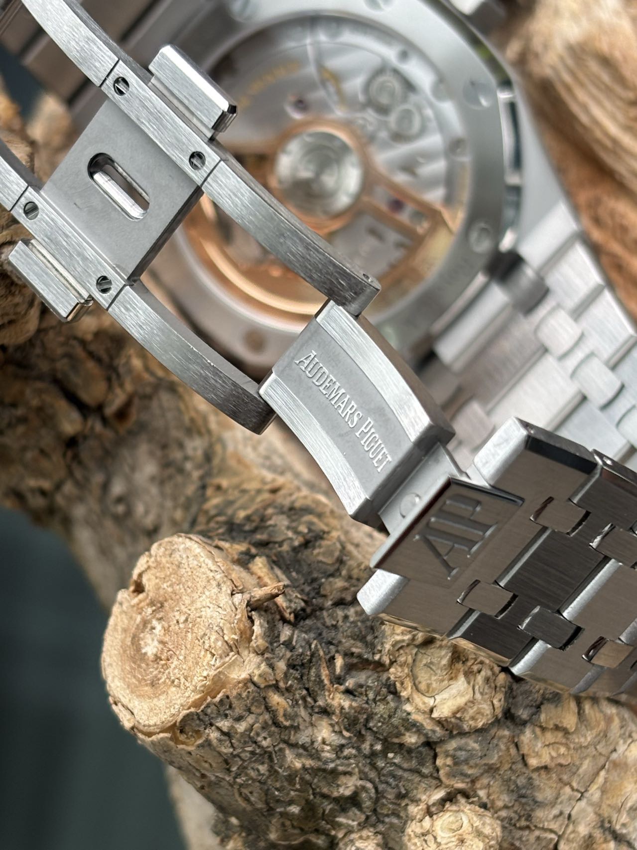 Audemars Piguet replica deployant clasp and bracelet finishing with visible movement in background