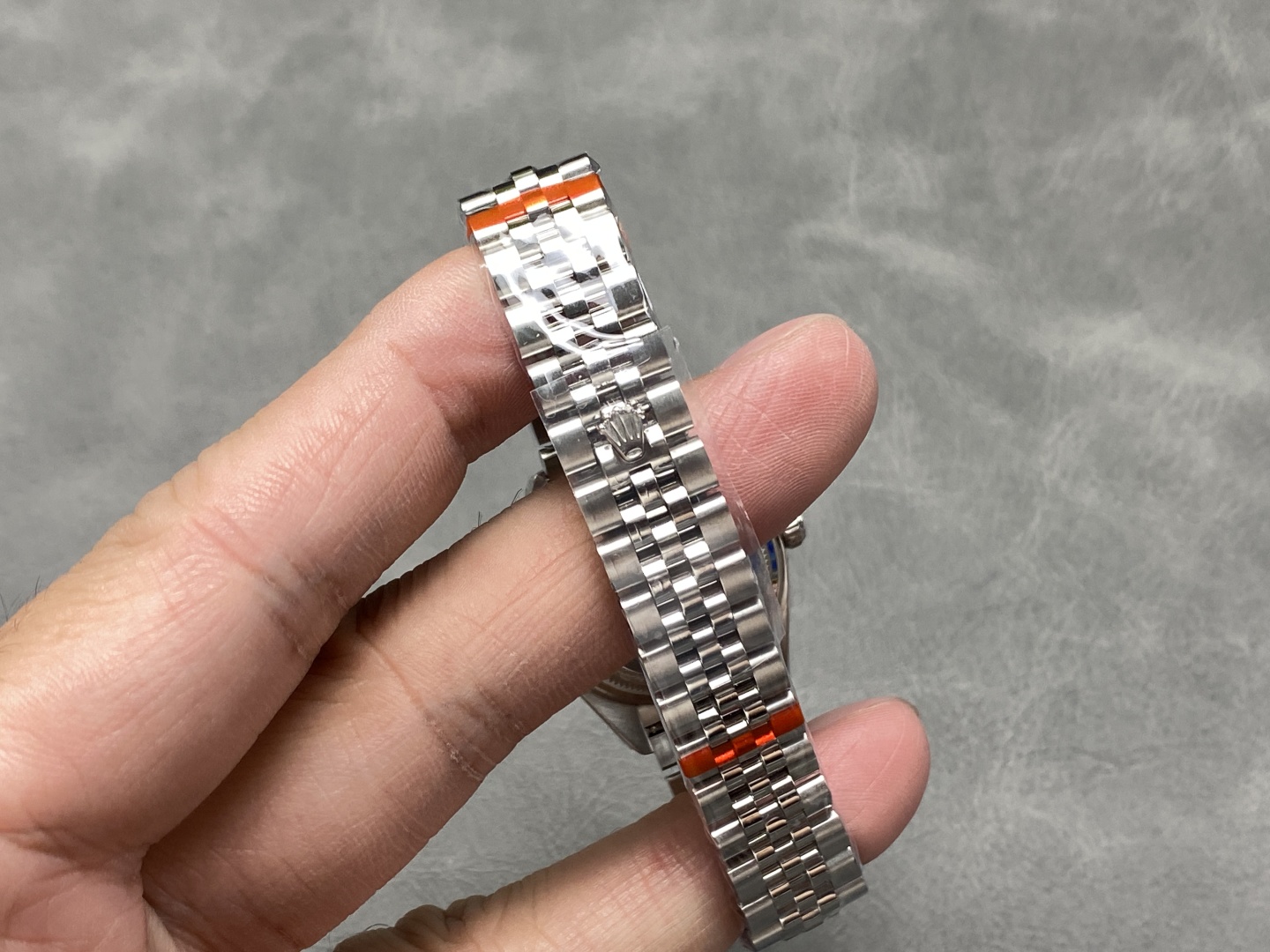 Jubilee bracelet with protective wraps and crown logo on a replica watch
