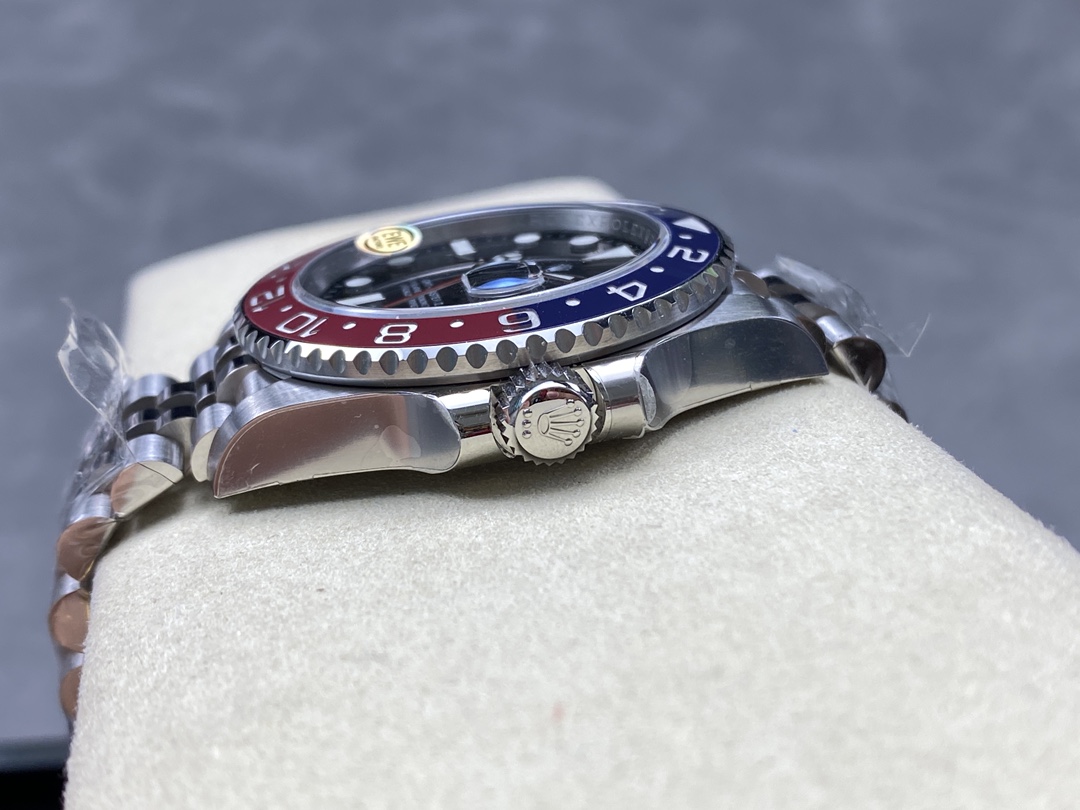 Side view of replica Rolex GMT-Master II showing crown and bezel profile