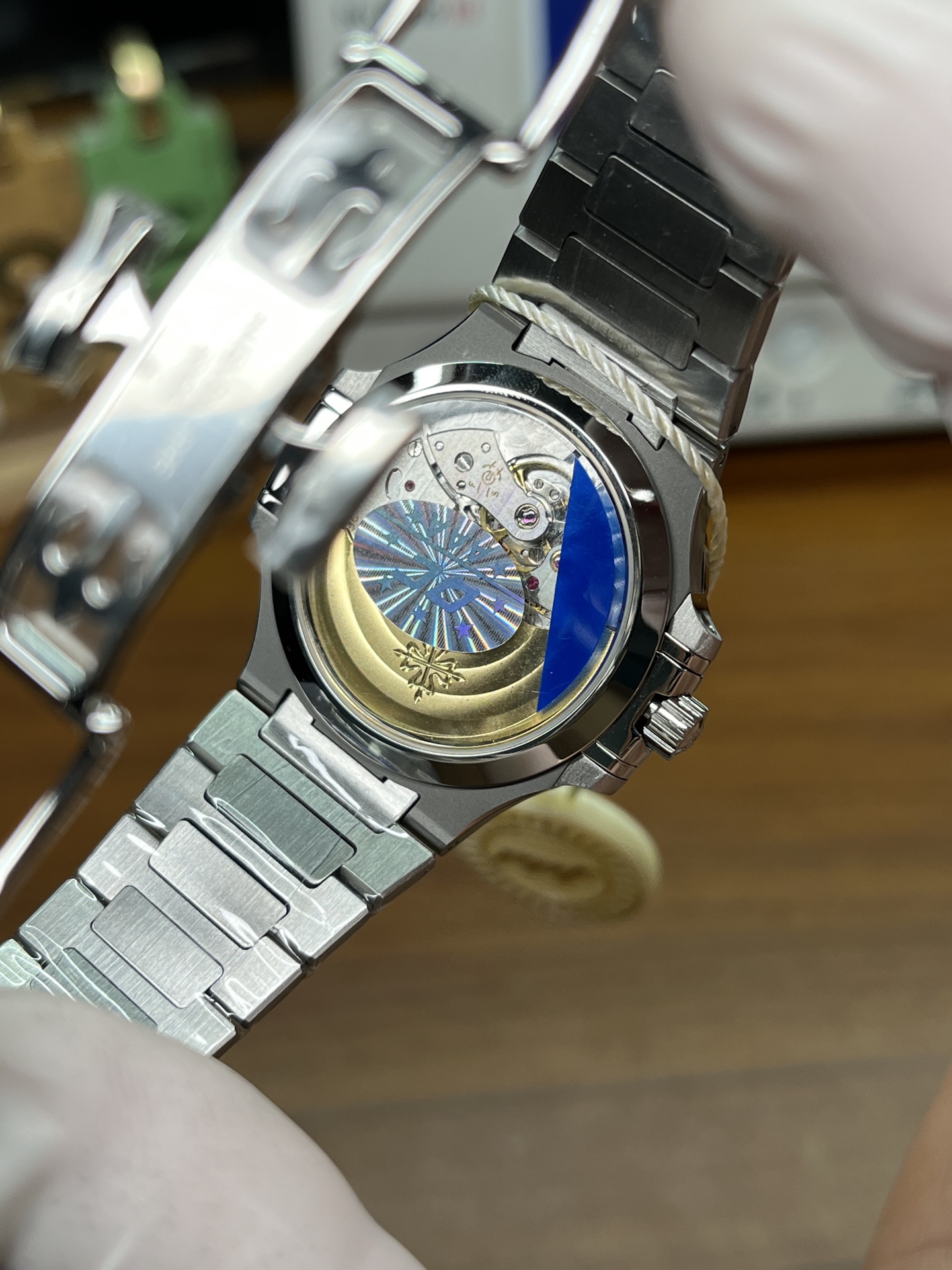 Patek Philippe Nautilus replica exhibition caseback showing decorated automatic movement and gold rotor