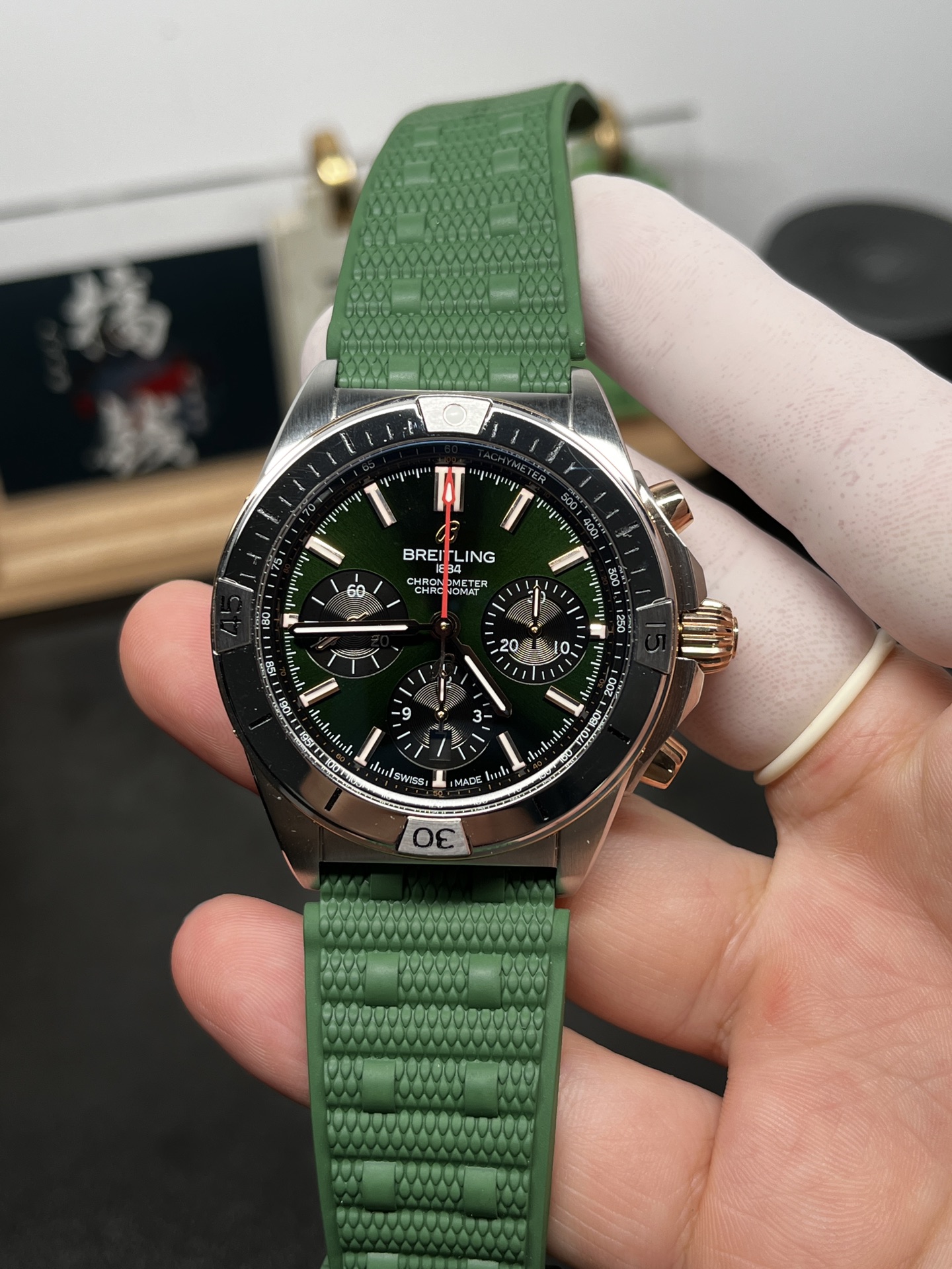 Breitling Chronomat replica green dial close-up front view