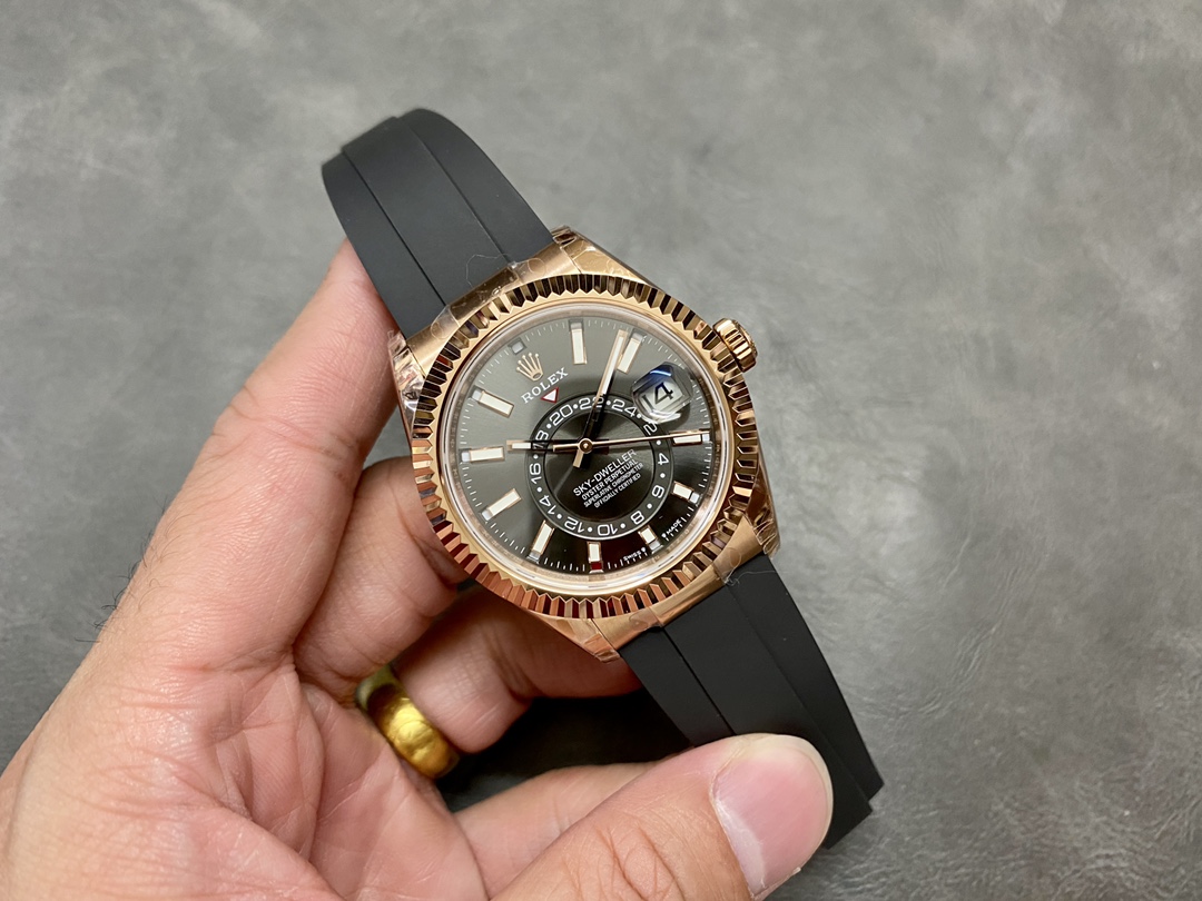 Rose gold replica Rolex Sky-Dweller with black rubber strap