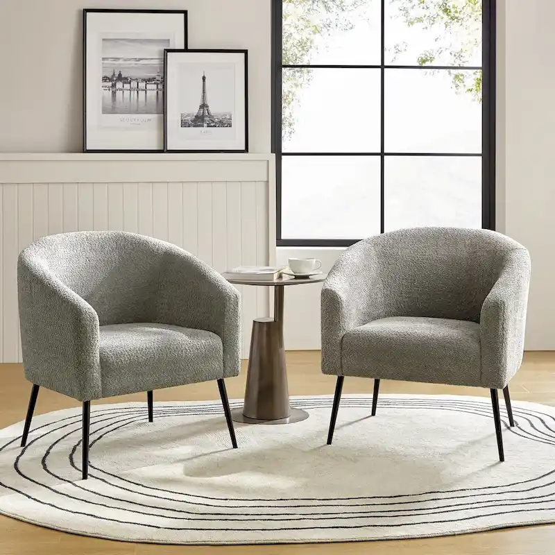 Modern armchair with round-back fabric armrests and metal legs, two chairs per set.
