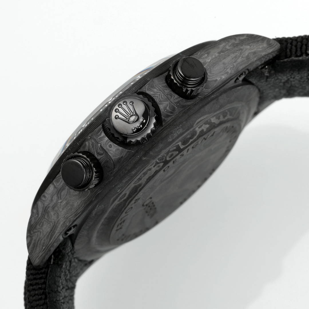 Angled side view of luxury replica wristwatch with wavy Damascus steel case, black chronograph pushers, and black fabric strap