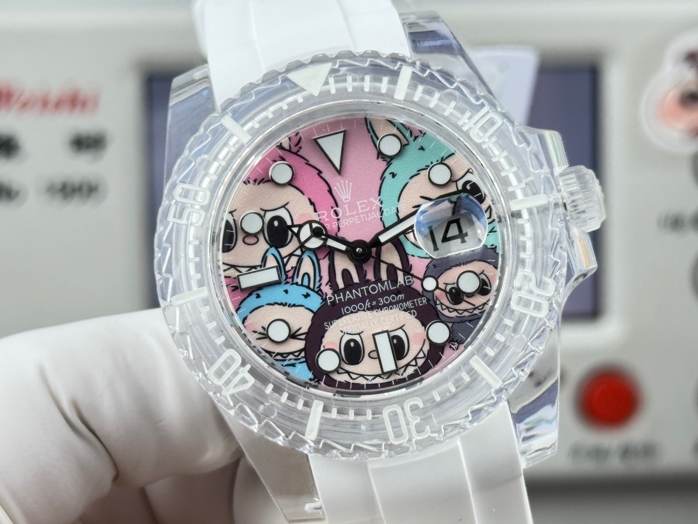 Front face of a clear custom Rolex-style watch with colorful cartoon characters and magnified date window