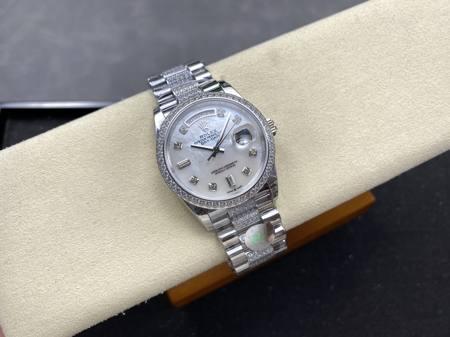 Angled view of luxury replica Day-Date 40 with diamond bezel and white dial