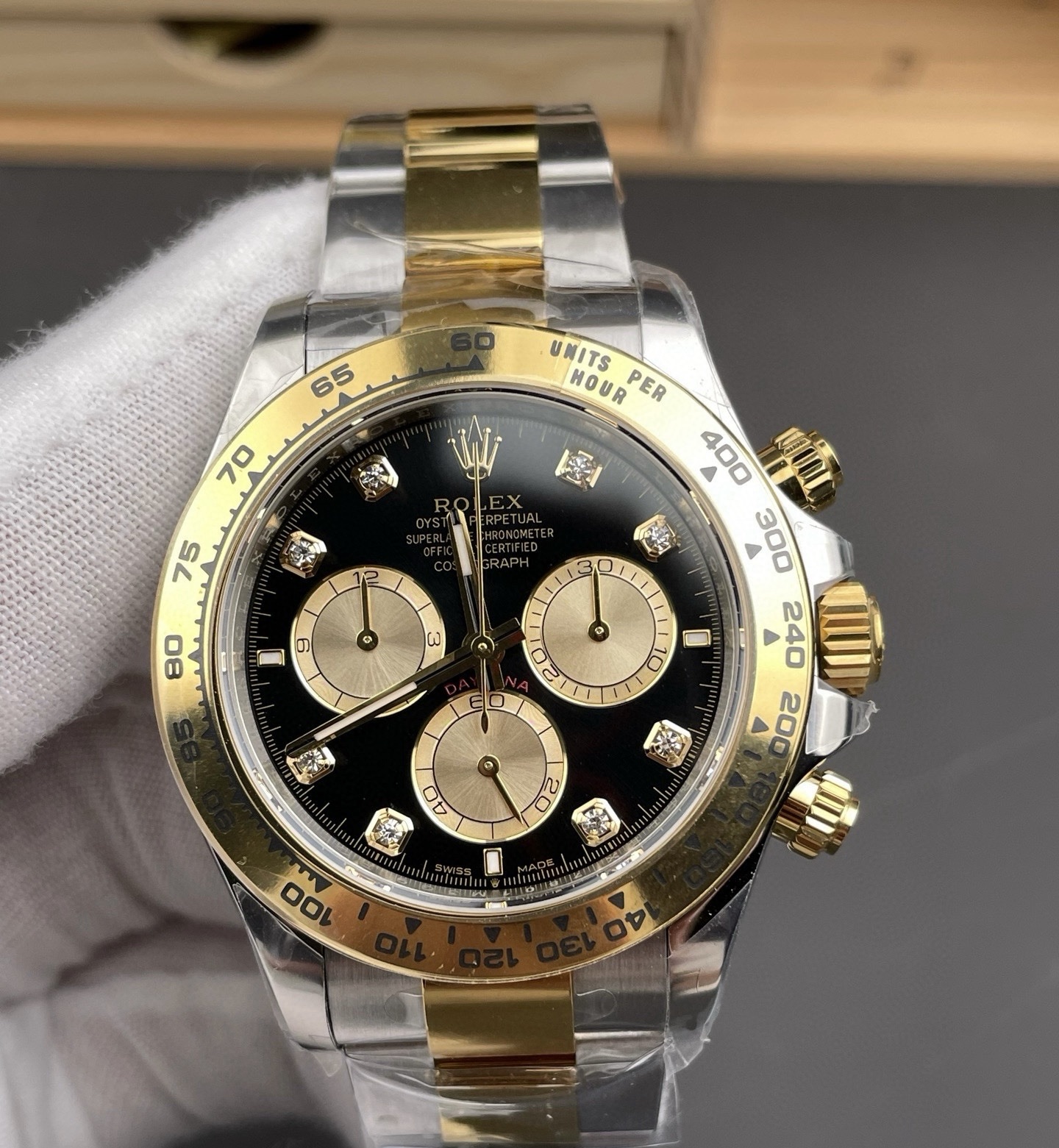 Front view of premium two-tone Rolex Cosmograph Daytona replica with 4131 movement, black dial and gold accents