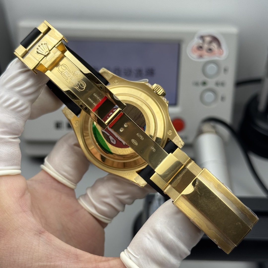 gold Rolex-style Oysterflex clasp and open caseback inspection