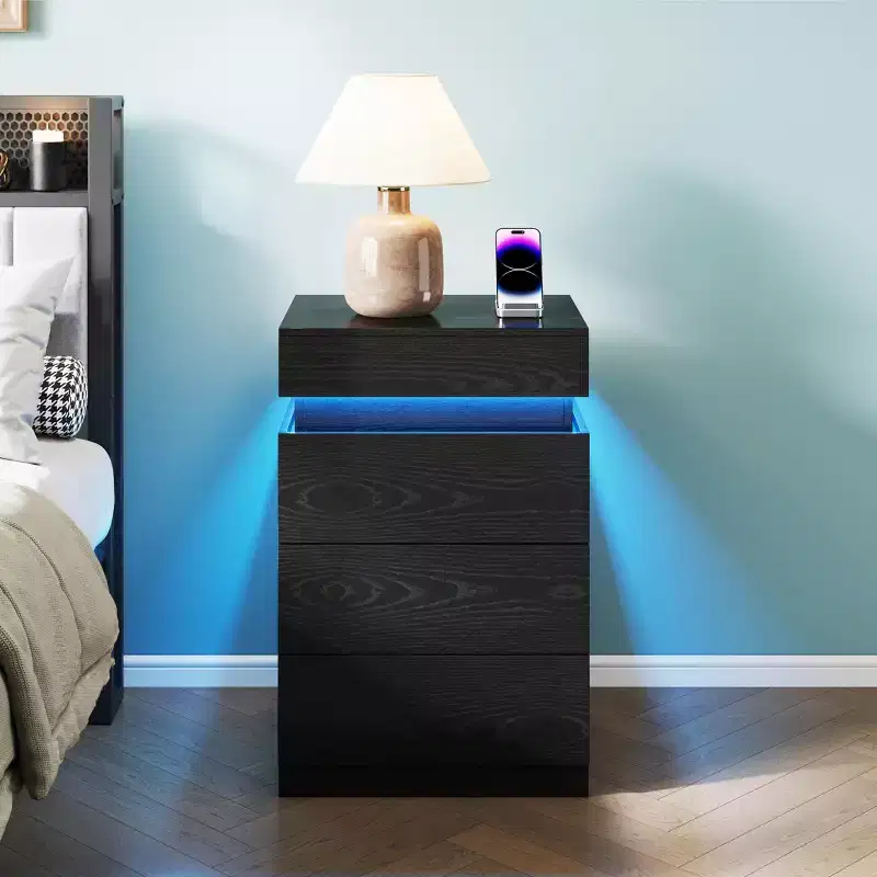 Nightstand with Built-In Charging Station and LED Lighting, 3-Drawer Sliding-Top Modern Bedside Table, Black Wooden End Table is a modern.
