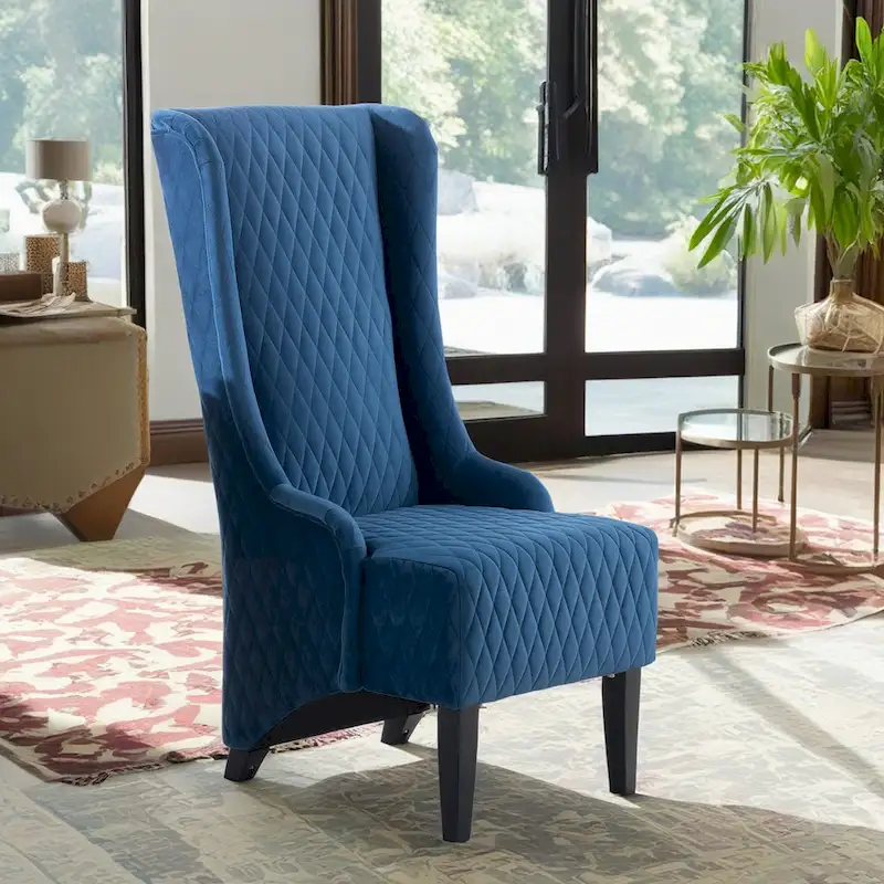 High-backed velvet wing-back chair with wooden legs