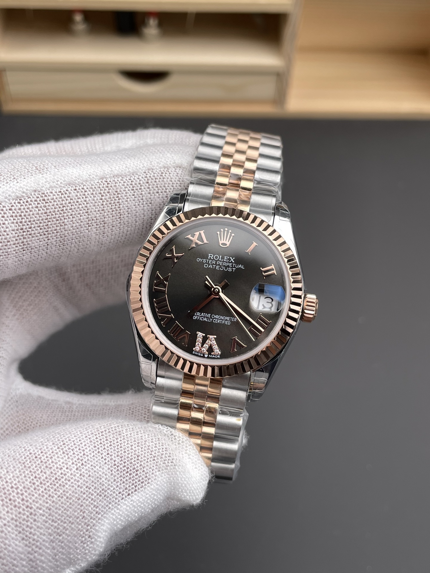 Two tone Rolex replica Datejust with black dial and rose gold fluted bezel