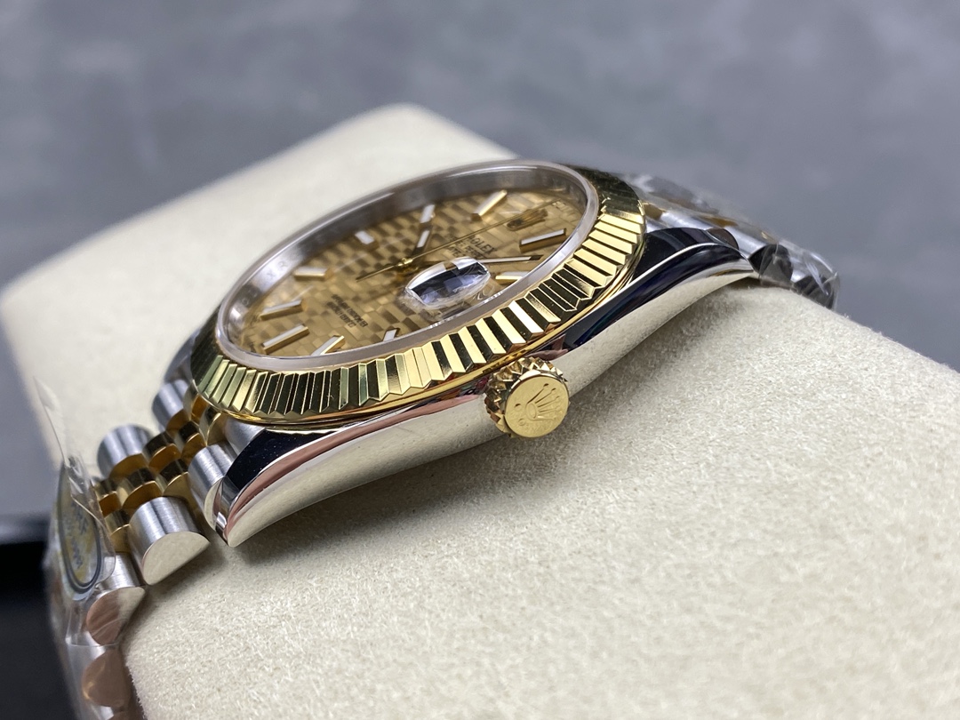 Side profile of two tone Datejust replica showing fluted bezel and crown