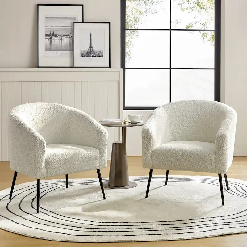 Modern armchair with round-back fabric armrests and metal legs, two chairs per set.