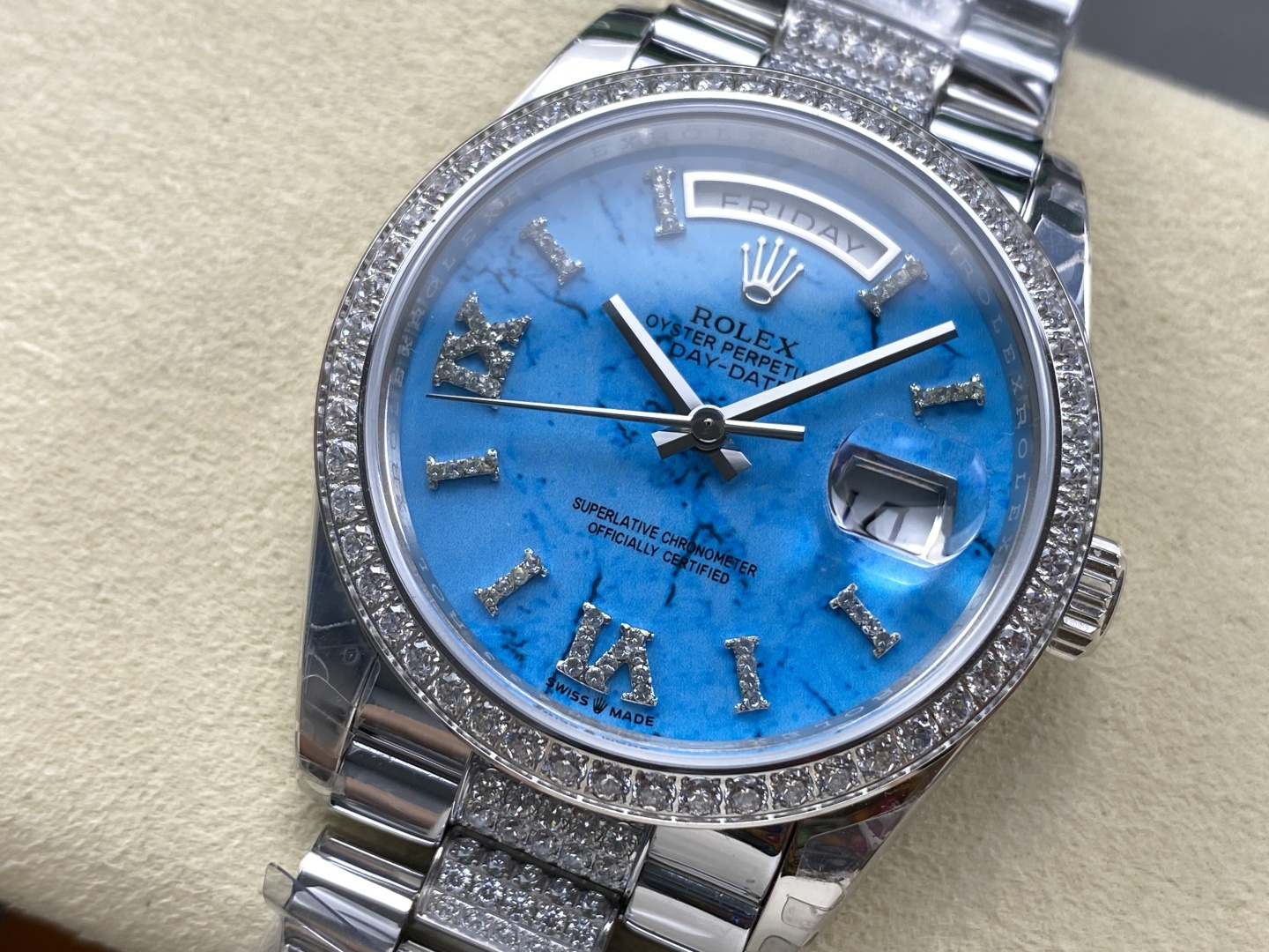 Azure blue stone dial with diamond markers on a fake Rolex