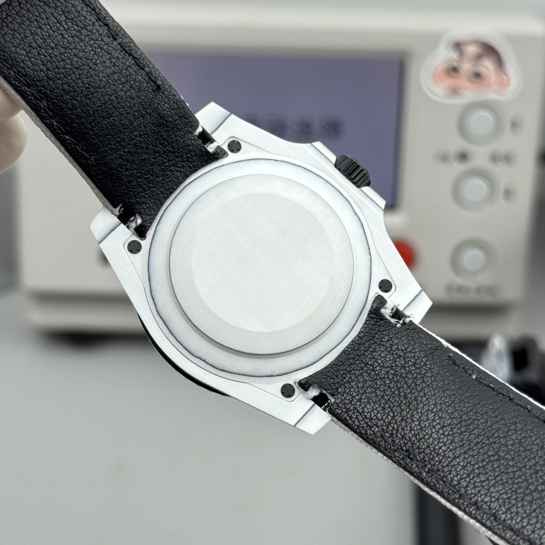 Caseback view of a white rolex replica watch with black leather underside strap