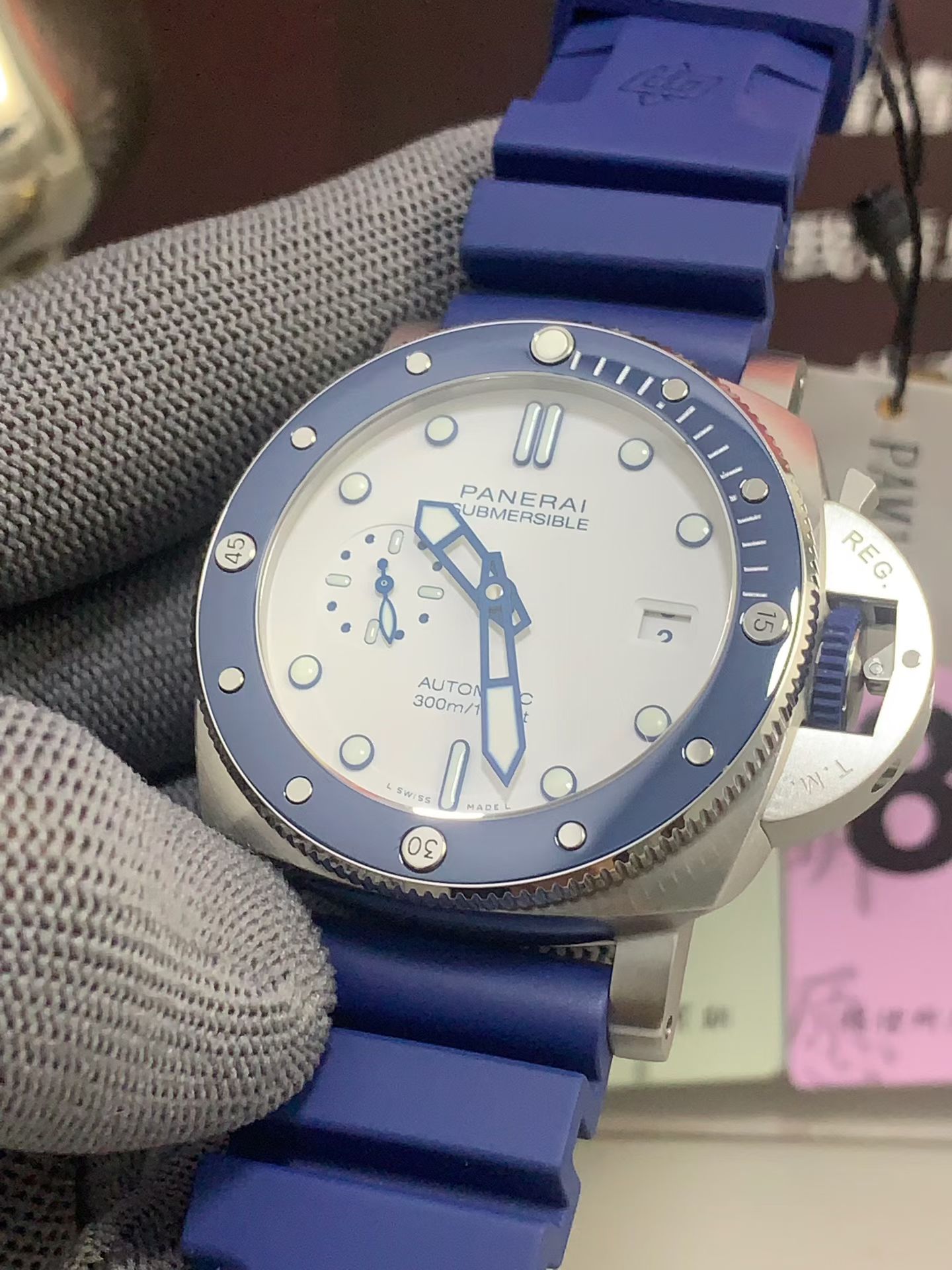 Close front angle of blue and white Panerai Submersible replica watch dial and bezel