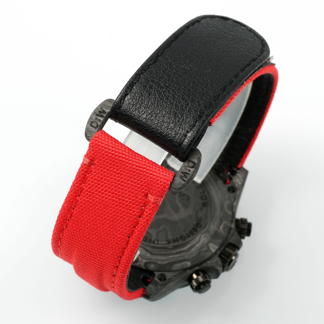 Close-up of the dual-material strap with black leather and red fabric, and carbon fiber case back of the Rolex super clone watch
