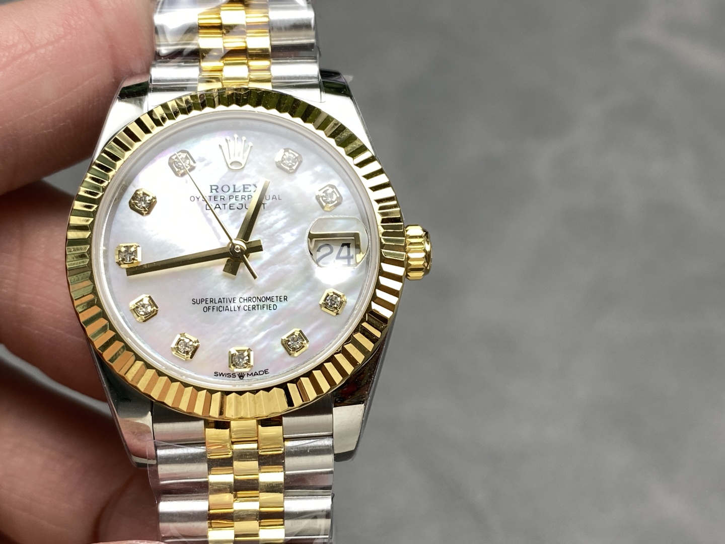 Jubilee style replica rolex two-tone Datejust with mother of pearl dial and diamond markers close-up