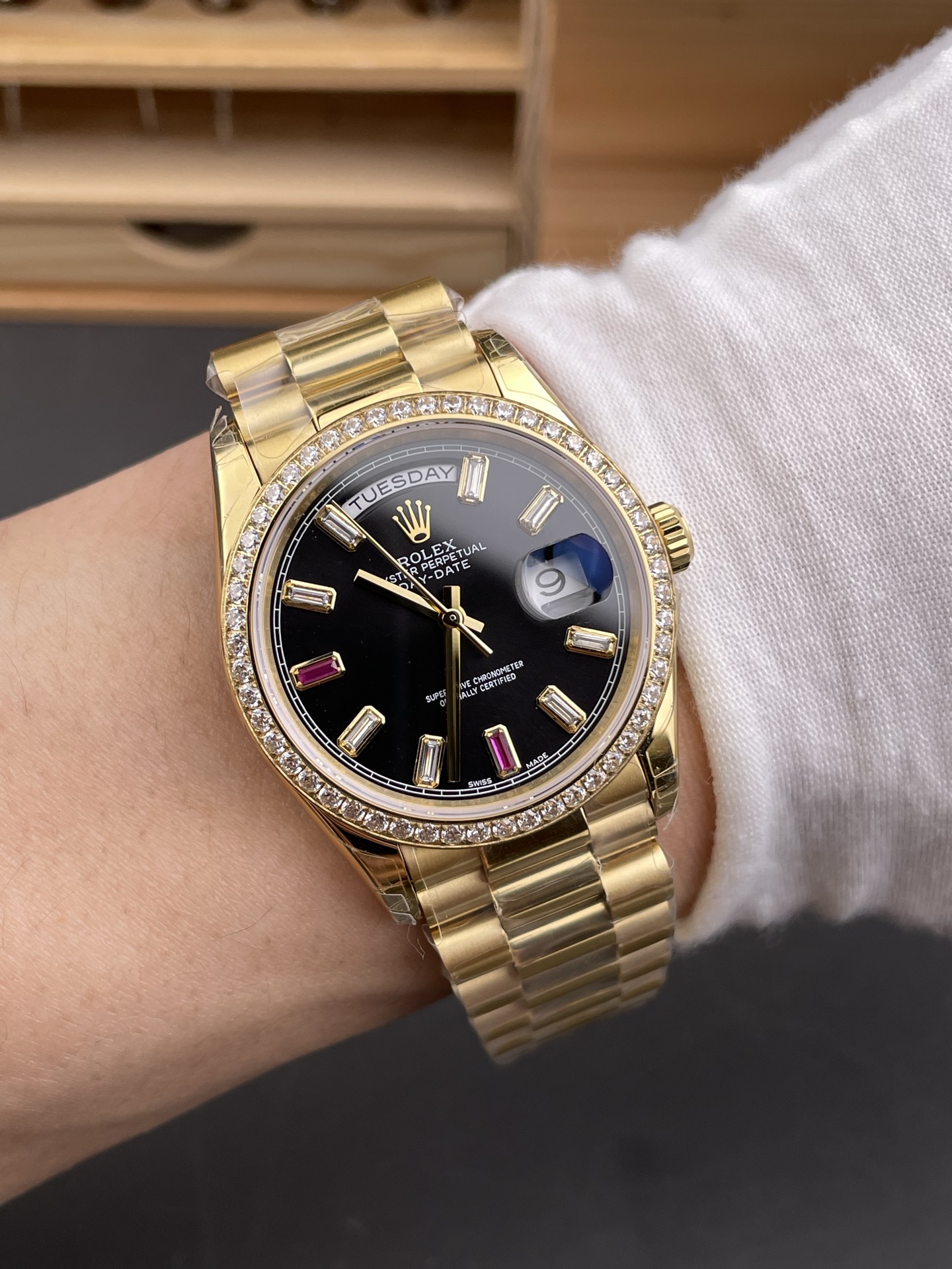 Rolex Day-Date replica 3255 wrist shot black dial diamond bezel yellow gold