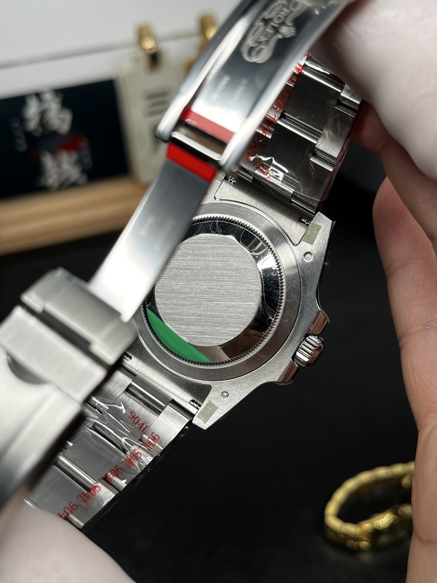 Rolex replica caseback and bracelet interior close-up