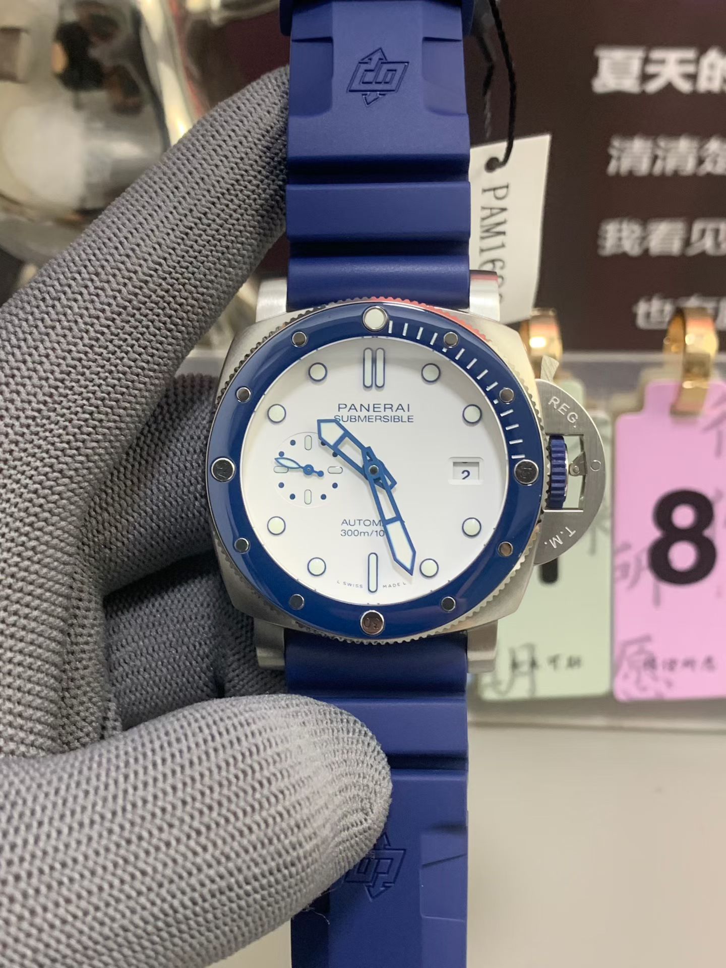 Panerai Submersible replica watch with blue rubber strap and white dial front view