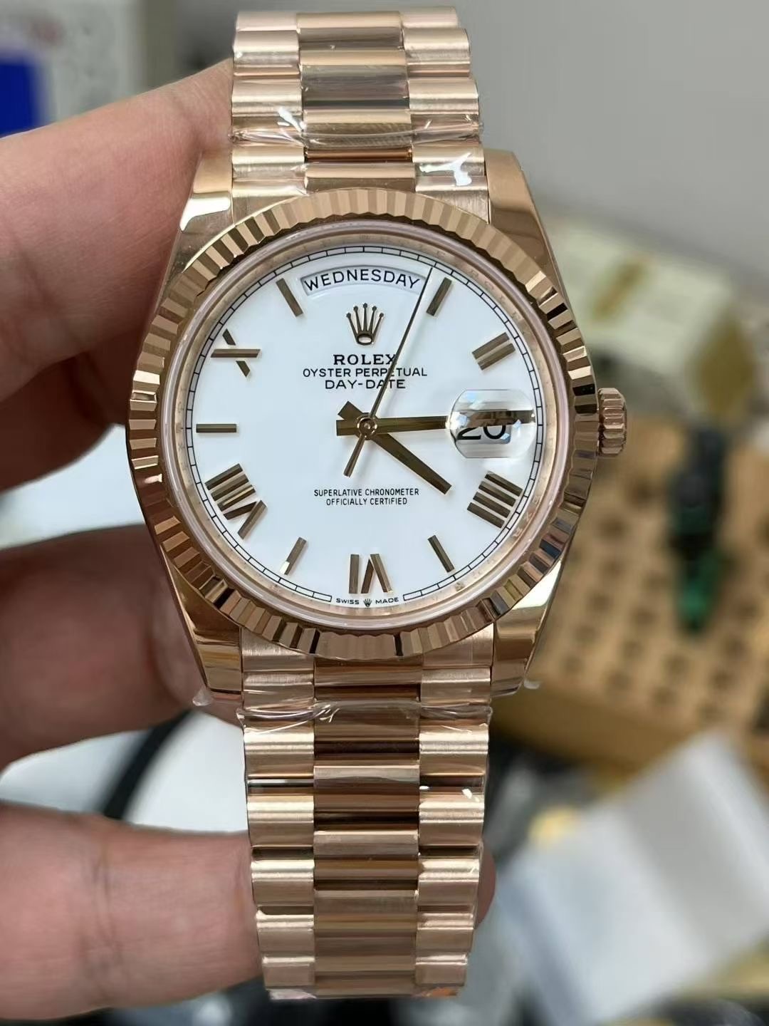 Rolex Day-Date rose gold replica with white dial Roman markers and fluted bezel