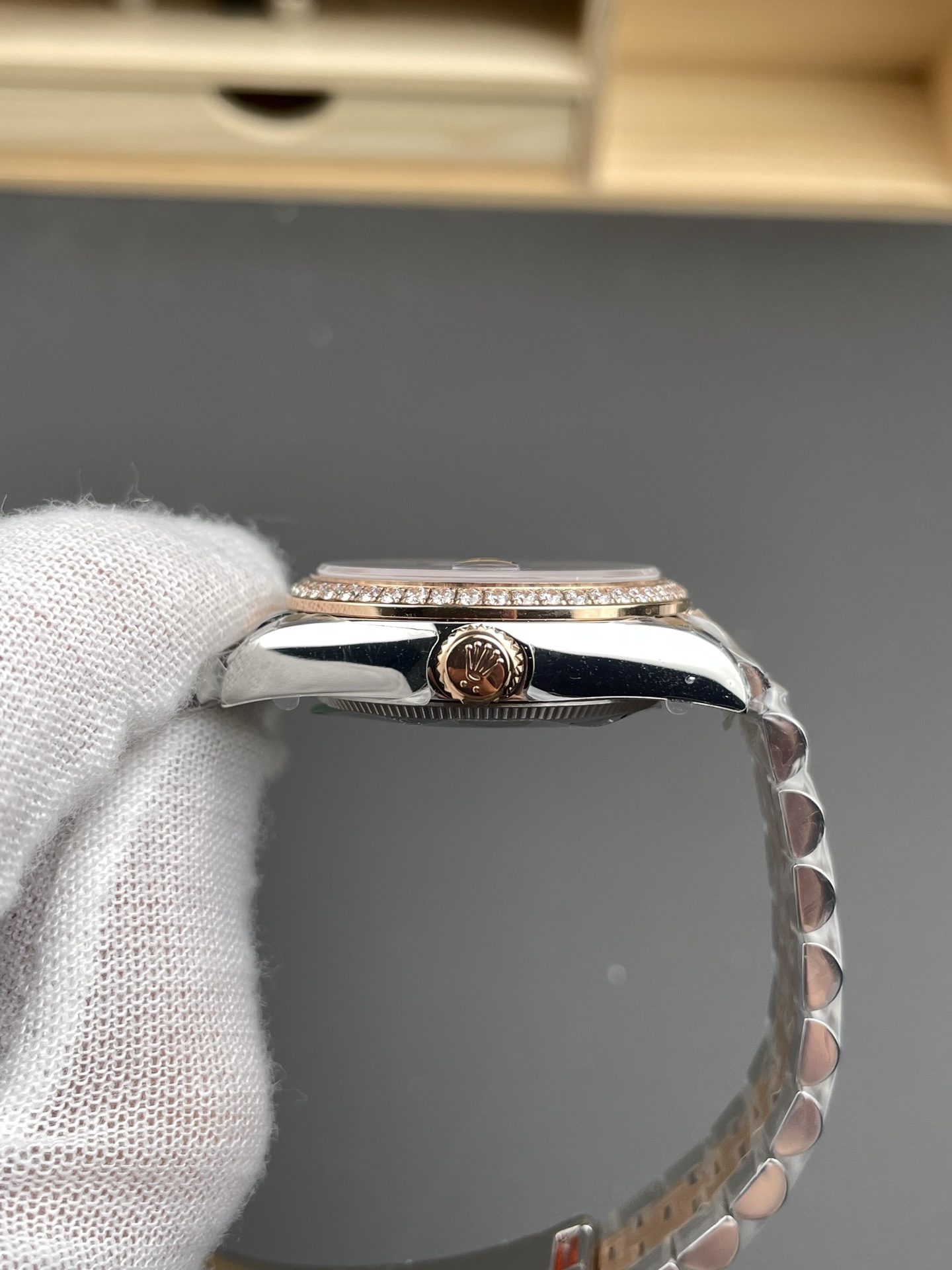 Side profile of two tone Rolex Datejust replica showing diamond bezel case thickness and crown