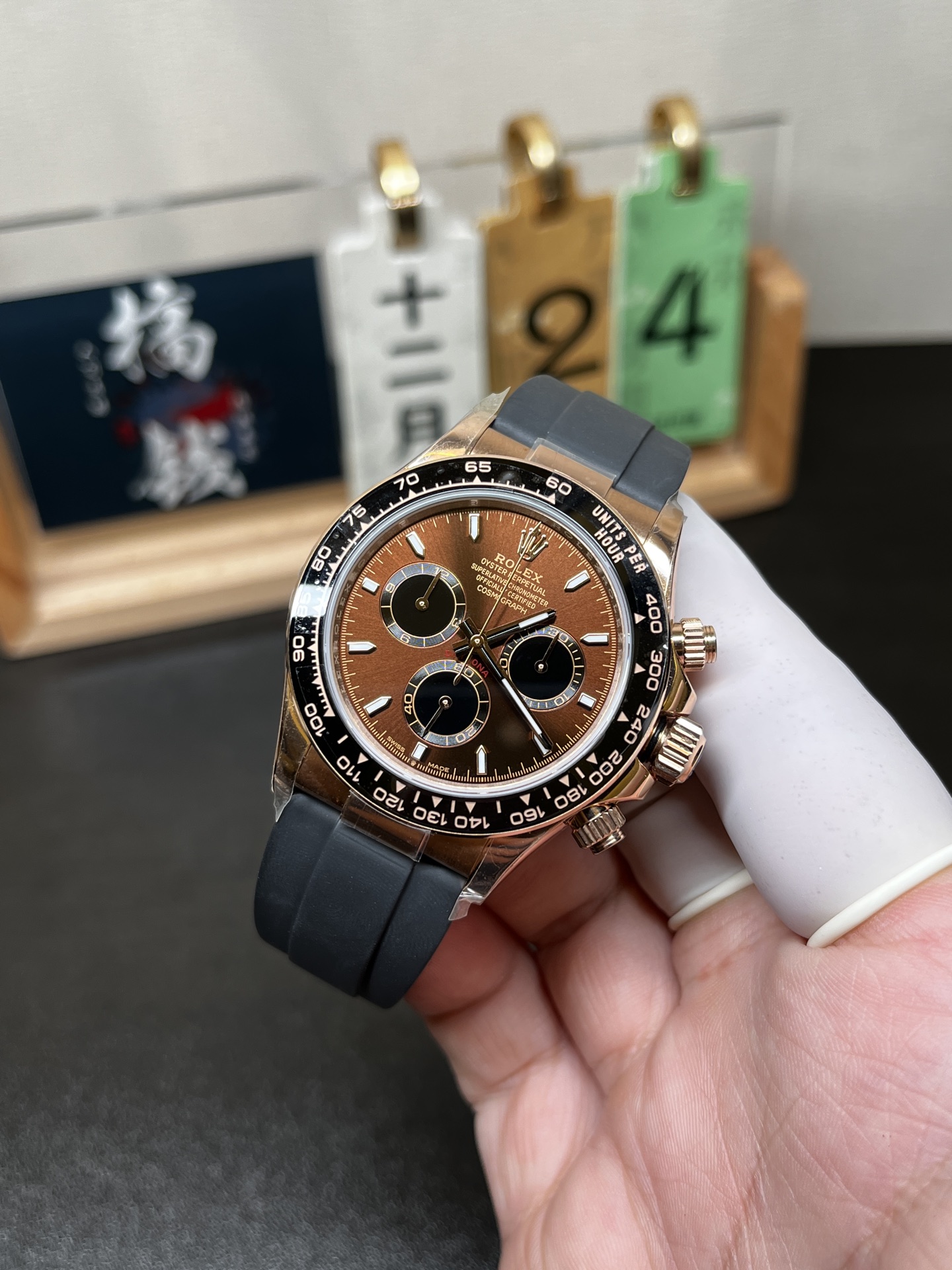 Angled wrist view of rose gold Rolex Daytona replica with Oysterflex strap