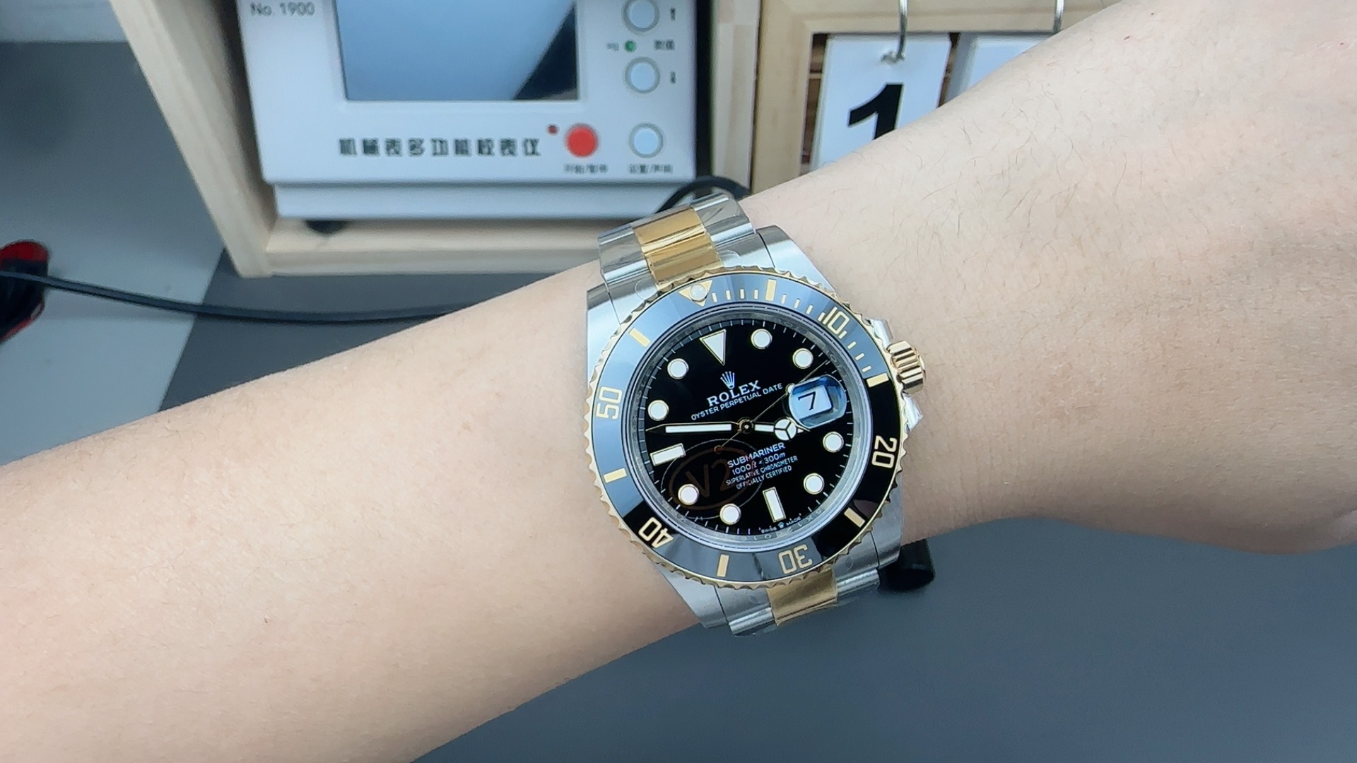Two tone replica Rolex Submariner on wrist showing overall proportions and wrist presence