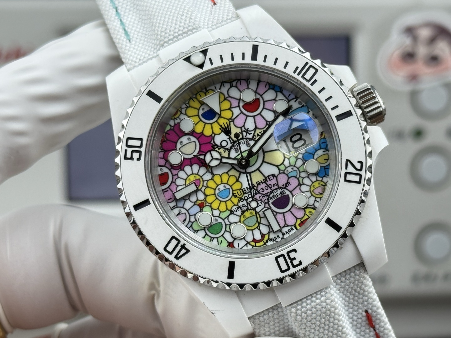 Rolex Submariner replica with colorful floral dial and white ceramic case
