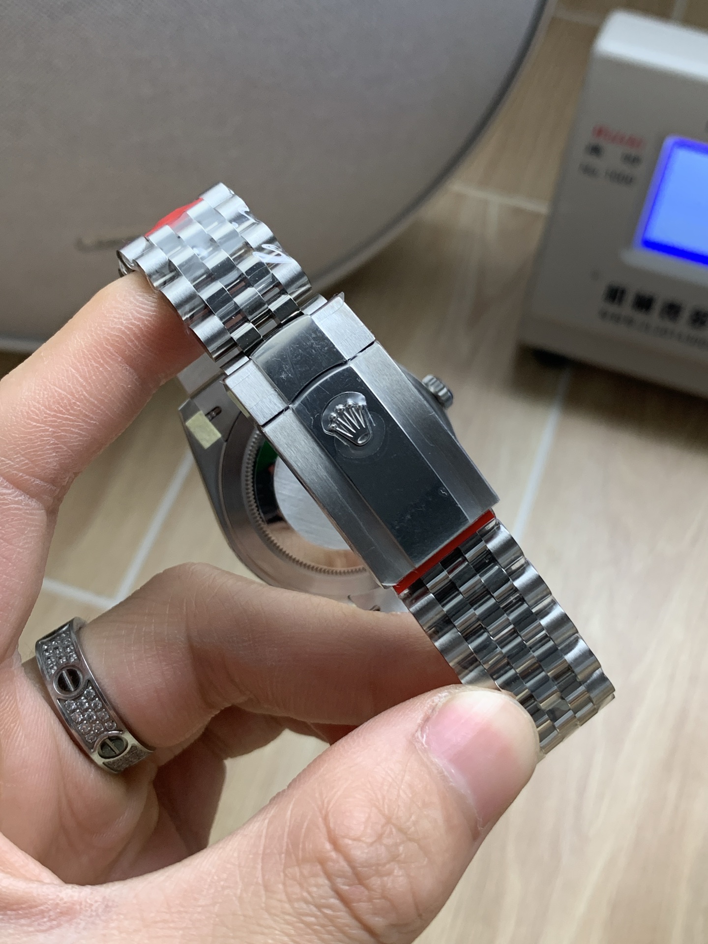Side profile of the Rolex Datejust replica showing the crown, fluted bezel, and jubilee bracelet curve