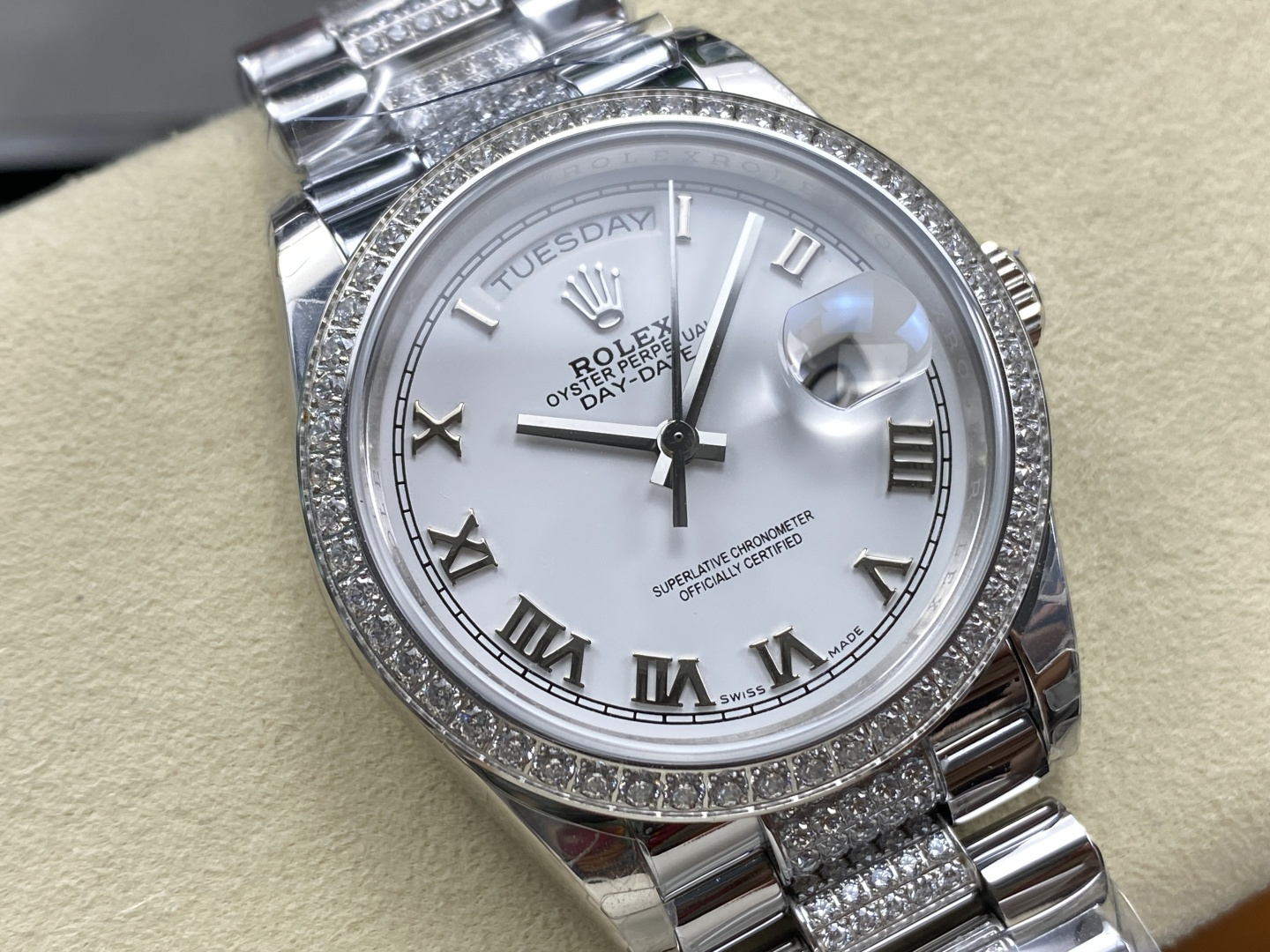 Macro shot of Rolex Day-Date white dial with Roman numerals and day-date window