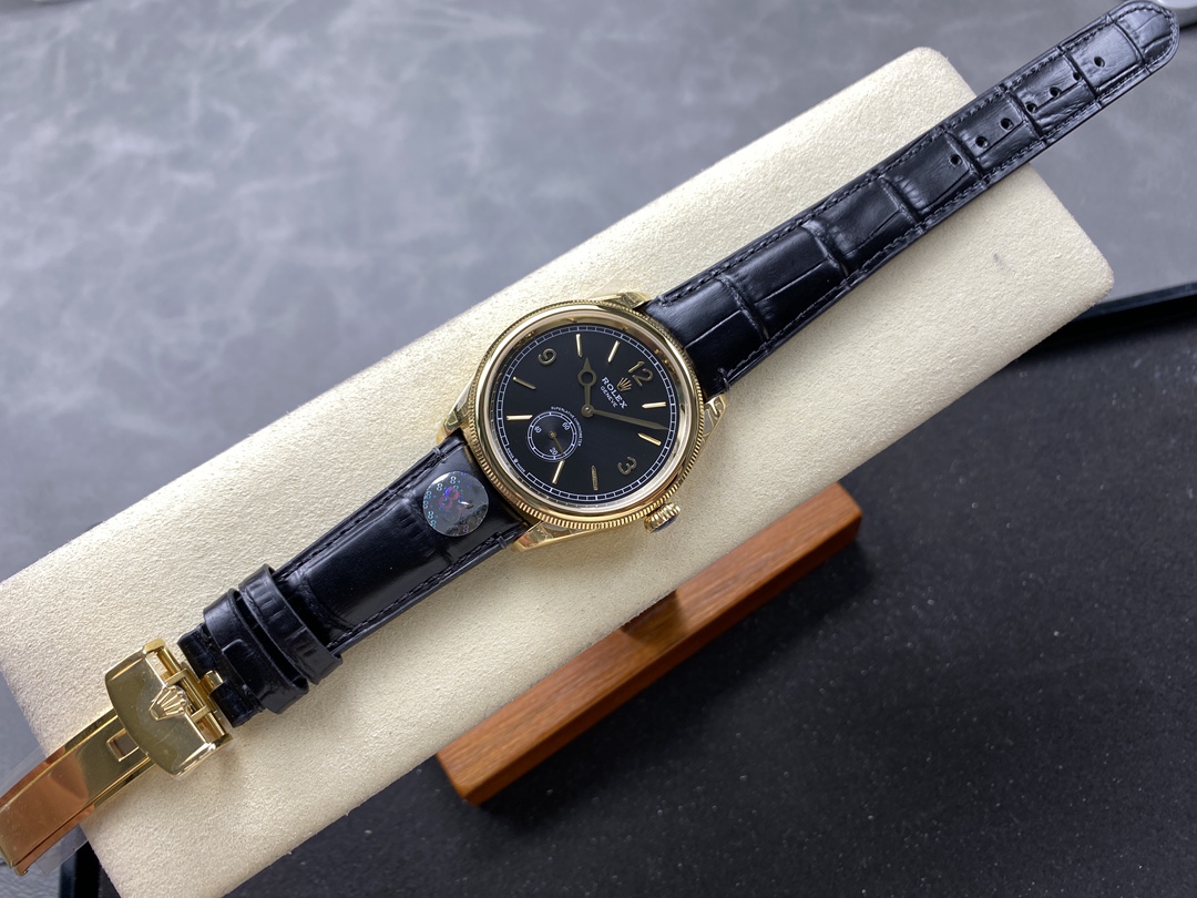 Rolex replica wrist view with black leather strap and gold case
