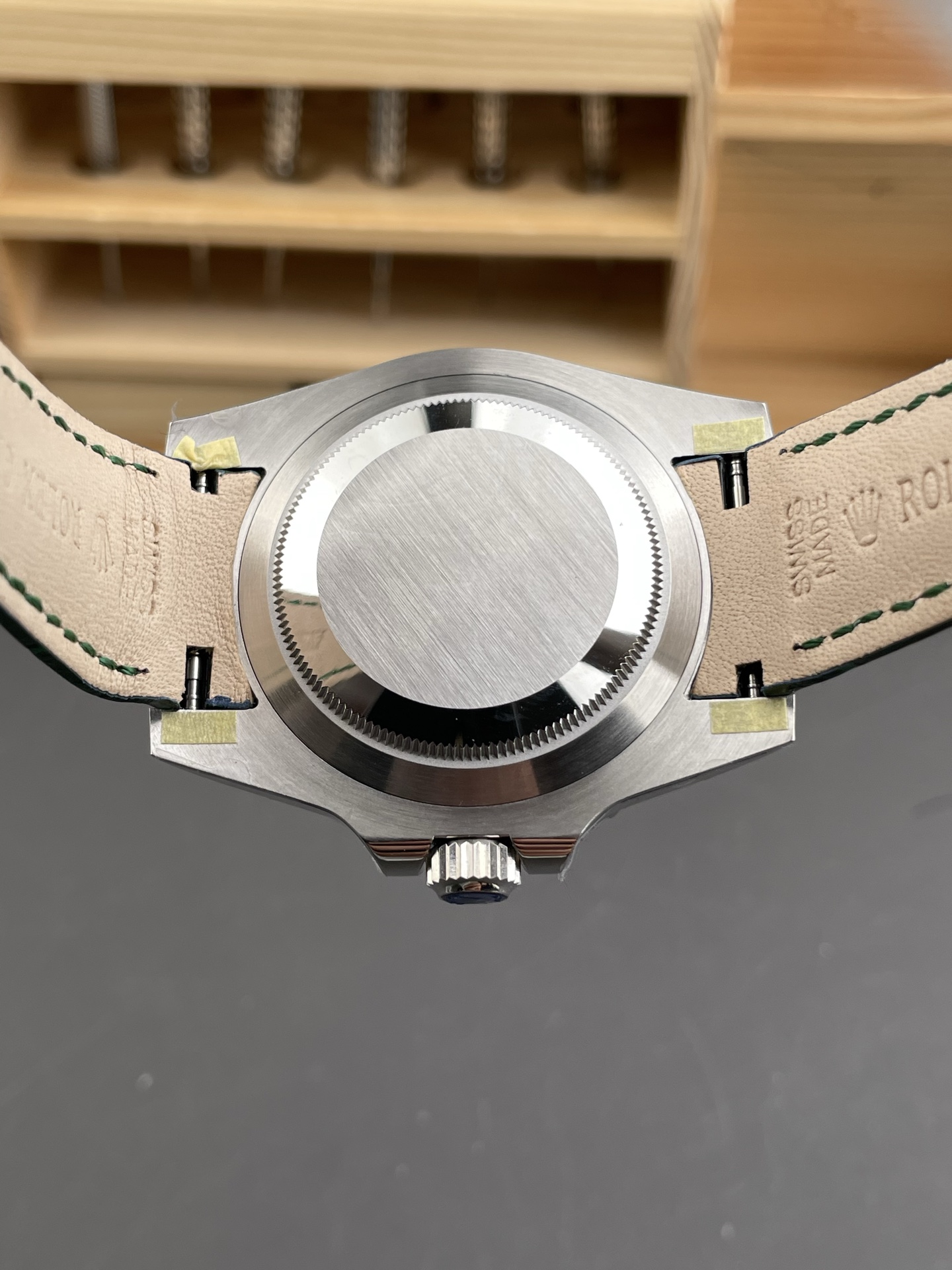 Green Rolex Submariner replica caseback and strap view