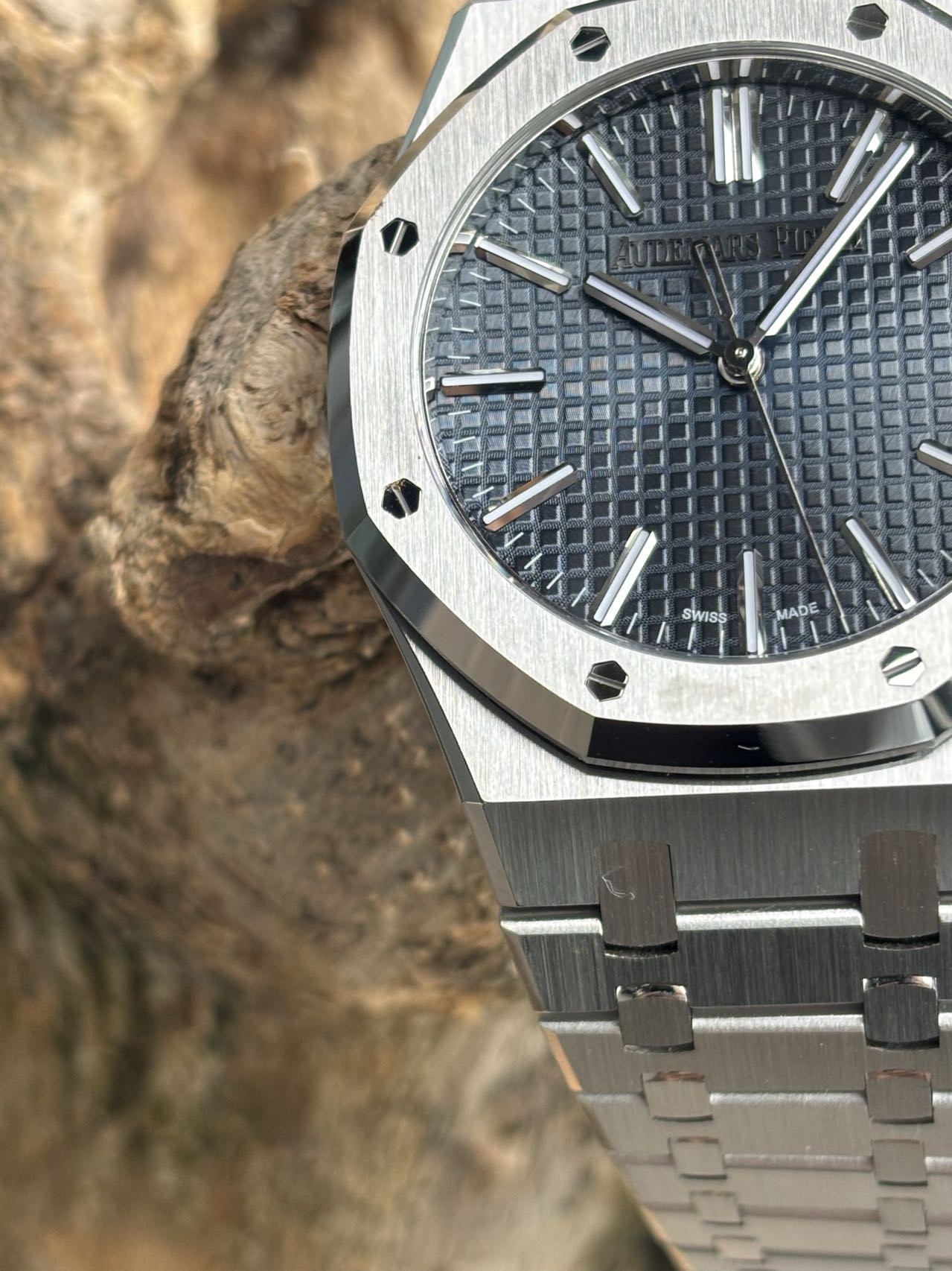 Audemars Piguet Royal Oak Tapisserie dial close-up with brushed bezel and integrated bracelet