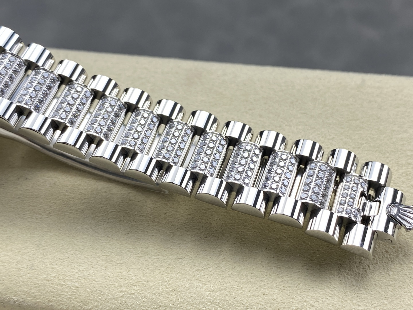 Close-up of diamond-set President bracelet links on a replica watch