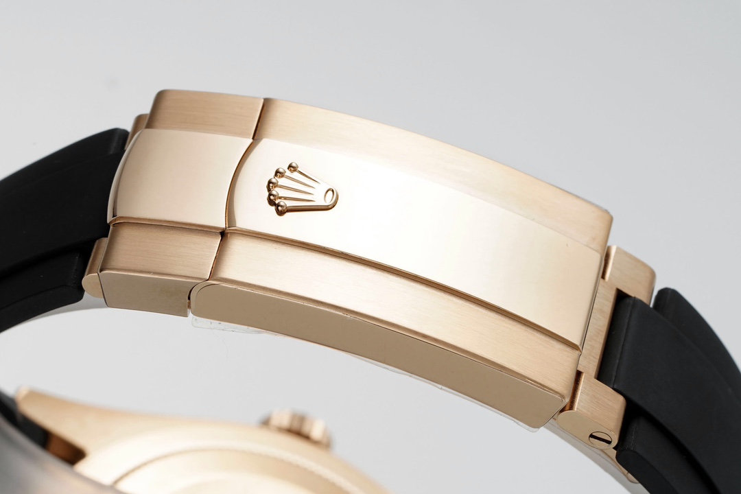 Close-up of the rose gold folding clasp and Oysterflex rubber strap on a replica Rolex