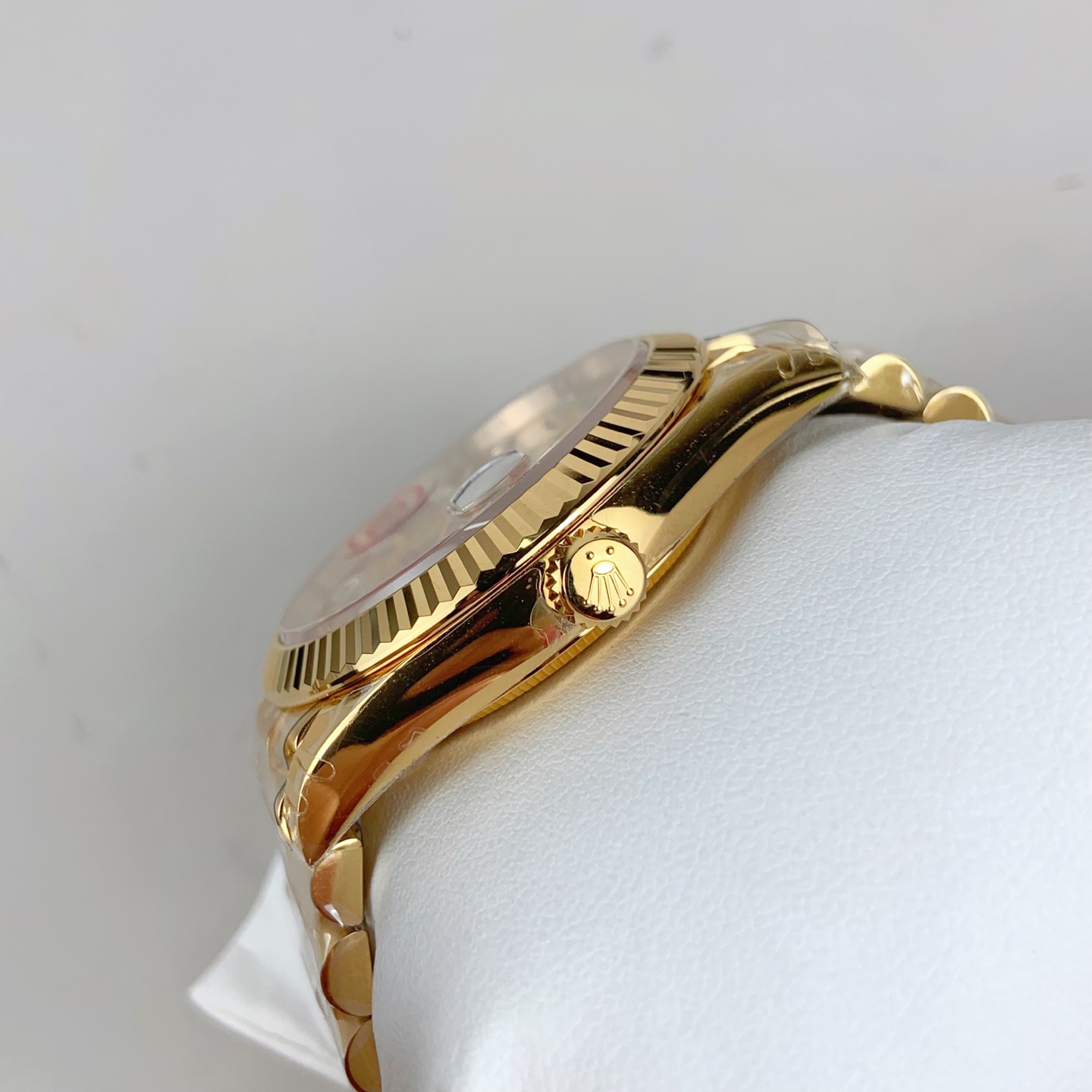 gold day-date dial with baguette markers and v2 sticker