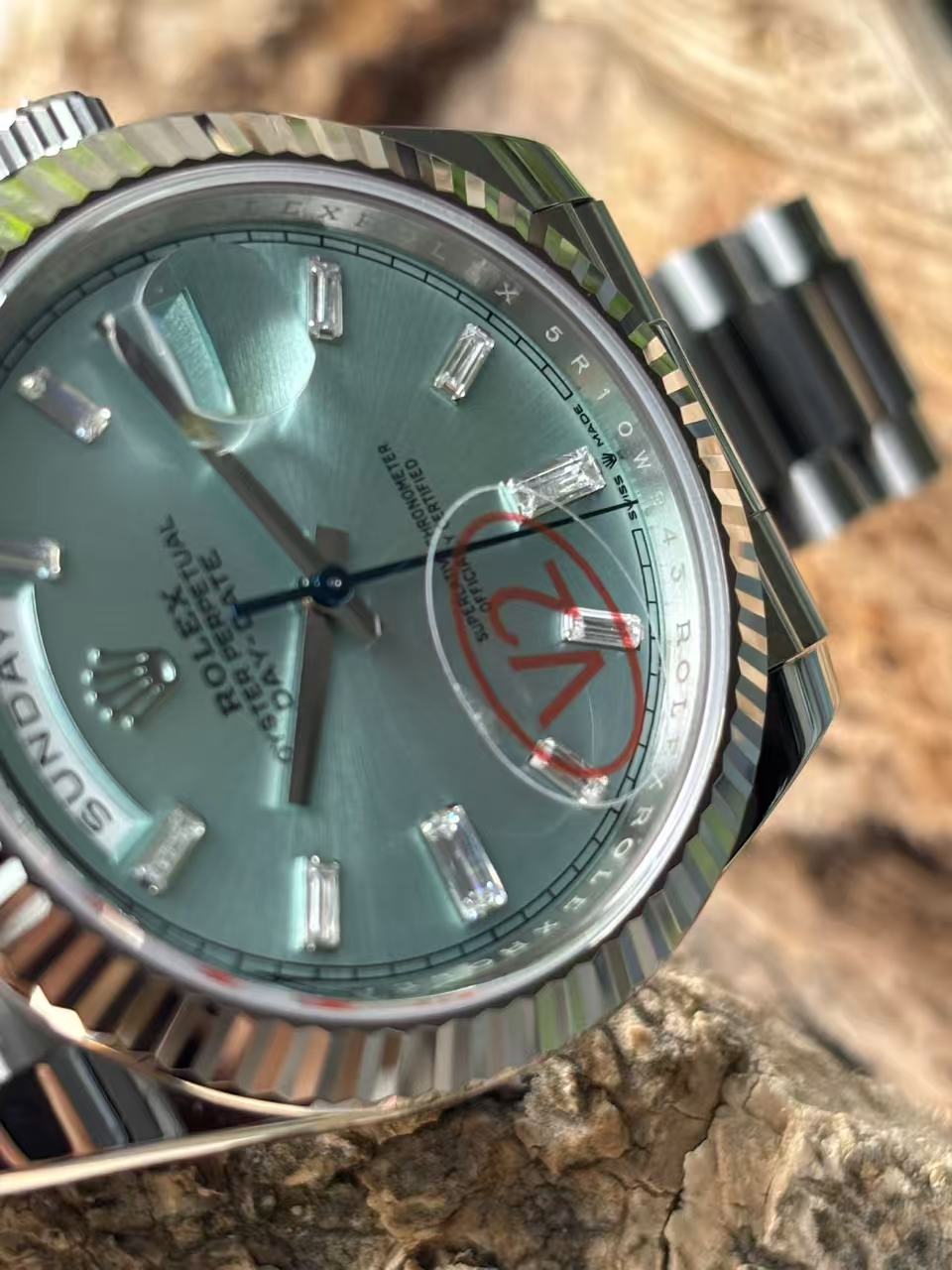 Rolex Day-Date replica macro dial detail with turquoise sunburst finish