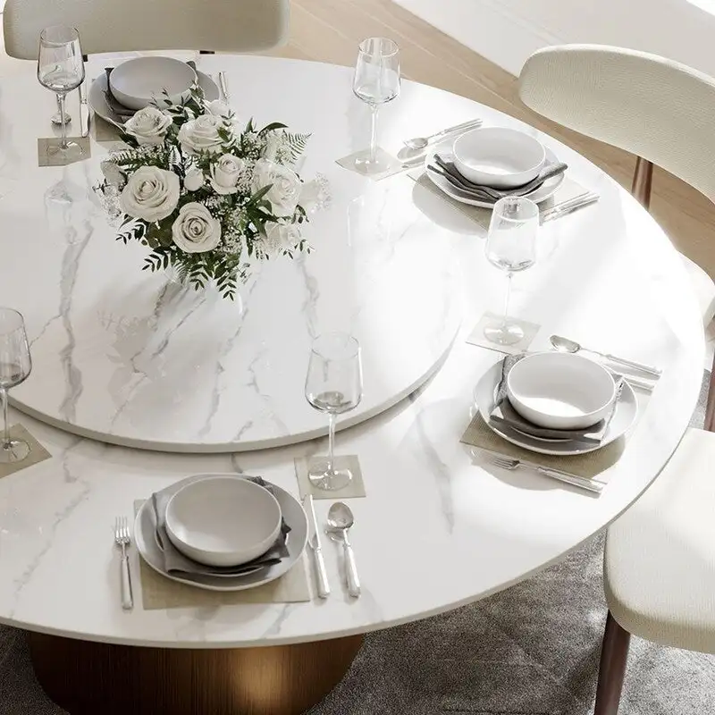 Modern Round Dining Table – White Sintered Stone Top & Bronze Carbon Pedestal