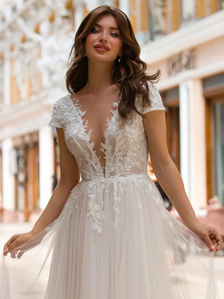 Sexy A Line Plunging Neckline Tulle Sweep Train Wedding Dress with Appliques