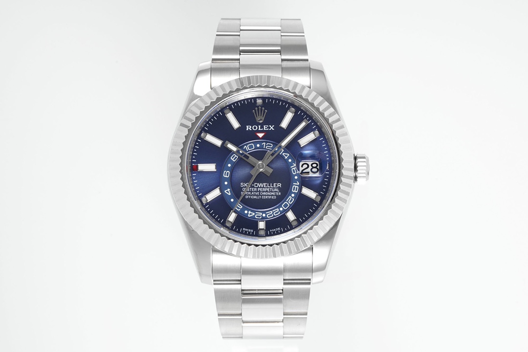 Rolex Sky-Dweller with deep blue sunburst dial featuring fluted bezel, date window at 3 o'clock, and 24-hour sub-dial