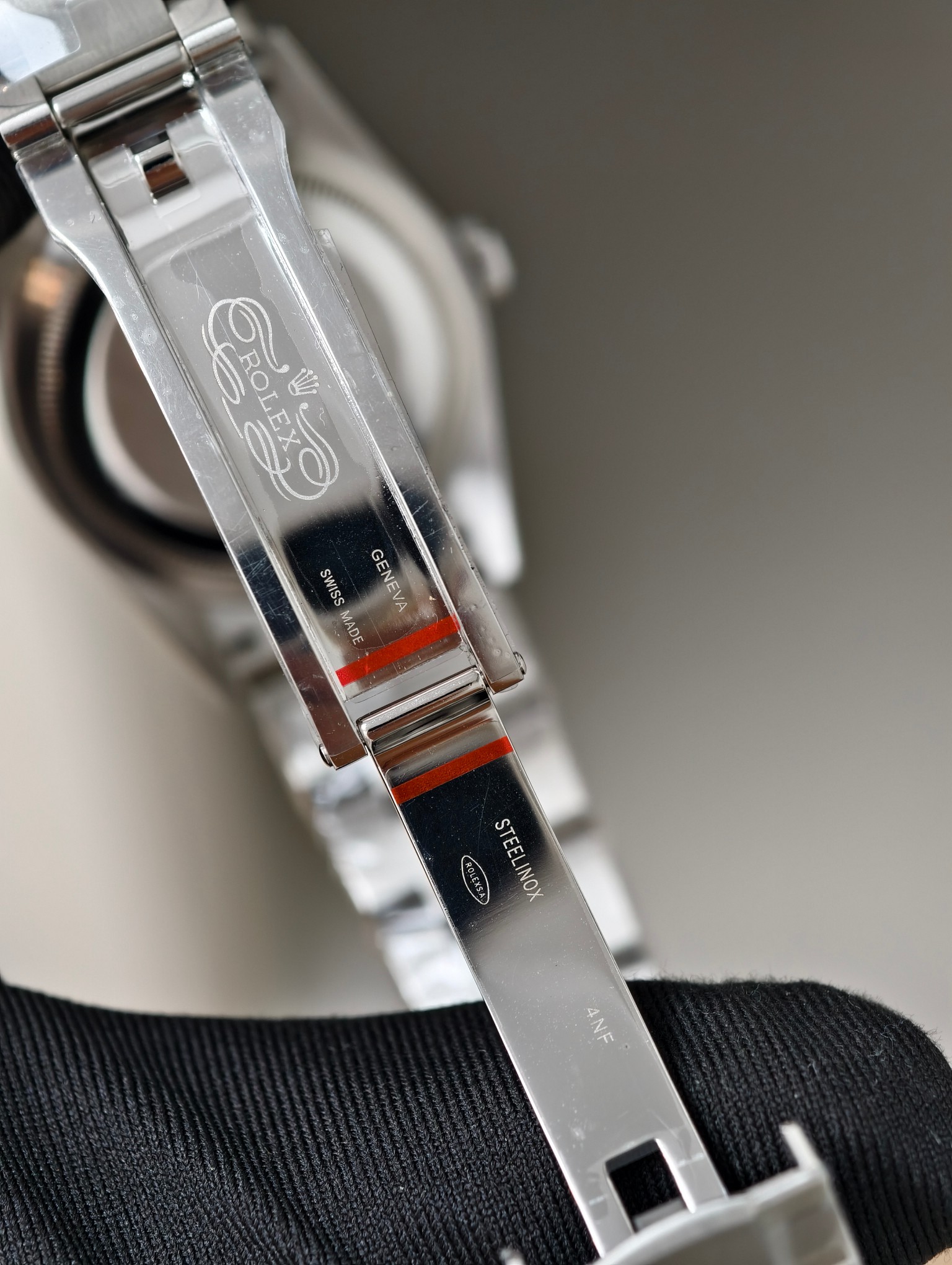 Detailed view of Rolex replica clasp engravings including Swiss Made and Geneva