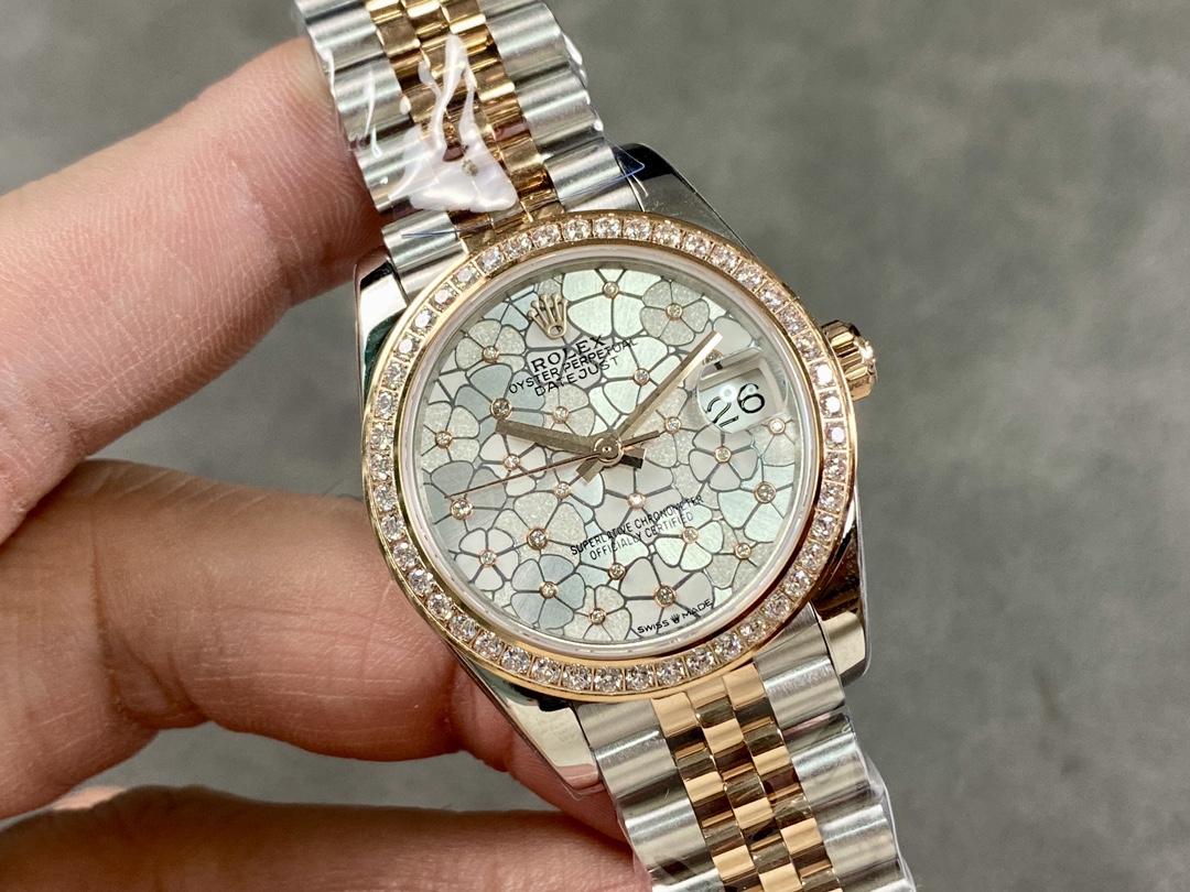 Close-up of a high-end Rolex Datejust 36 replica with floral dial and diamond-set bezel